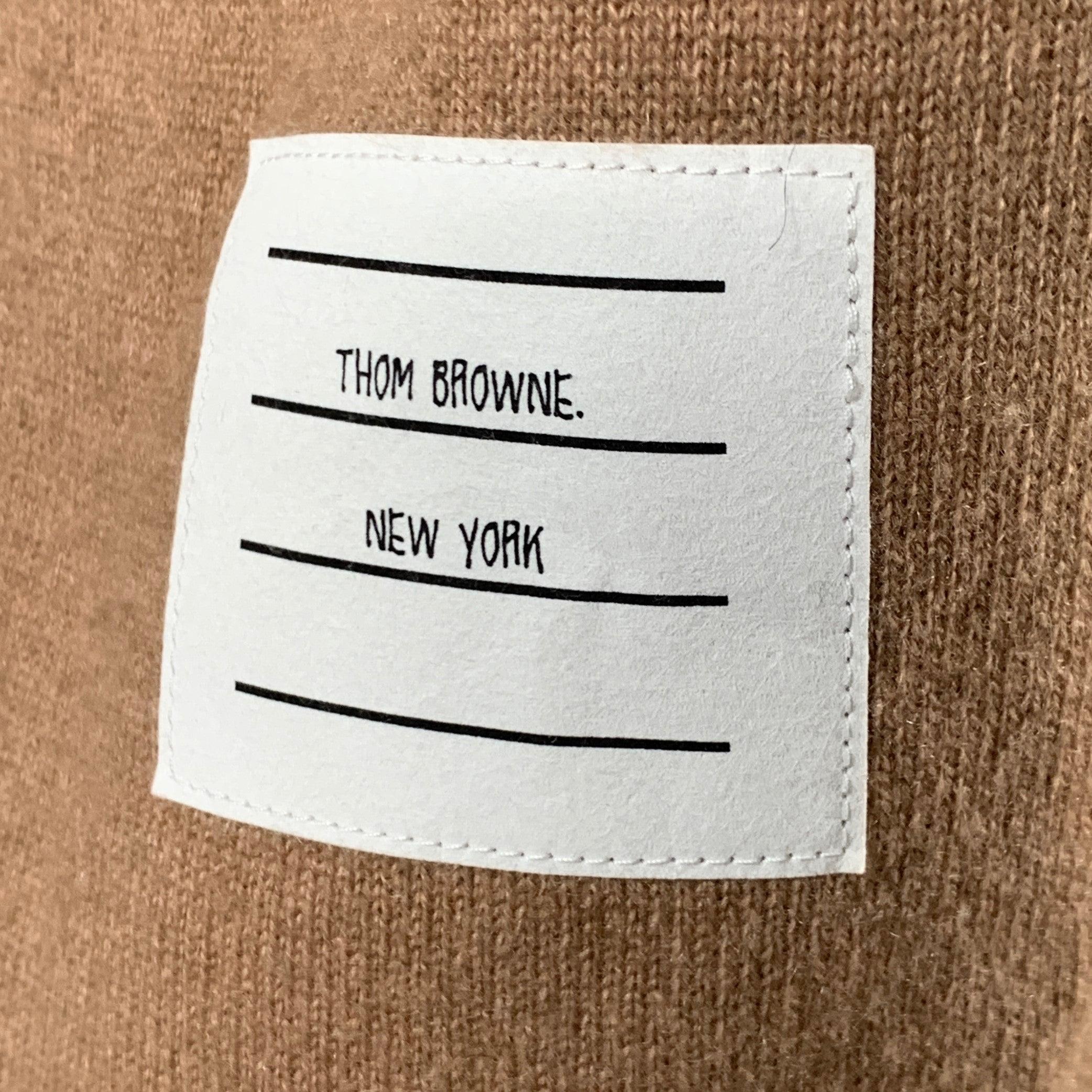THOM BROWNE sweater
in a brown cashmere blend knit featuring cream signature sleeve stripes, button cuff and hem details, and crew neck. Made in Italy.Excellent Pre-Owned Condition. 

Marked:   IT 38 

Measurements: 
 
Shoulder: 18 inches Bust: 38