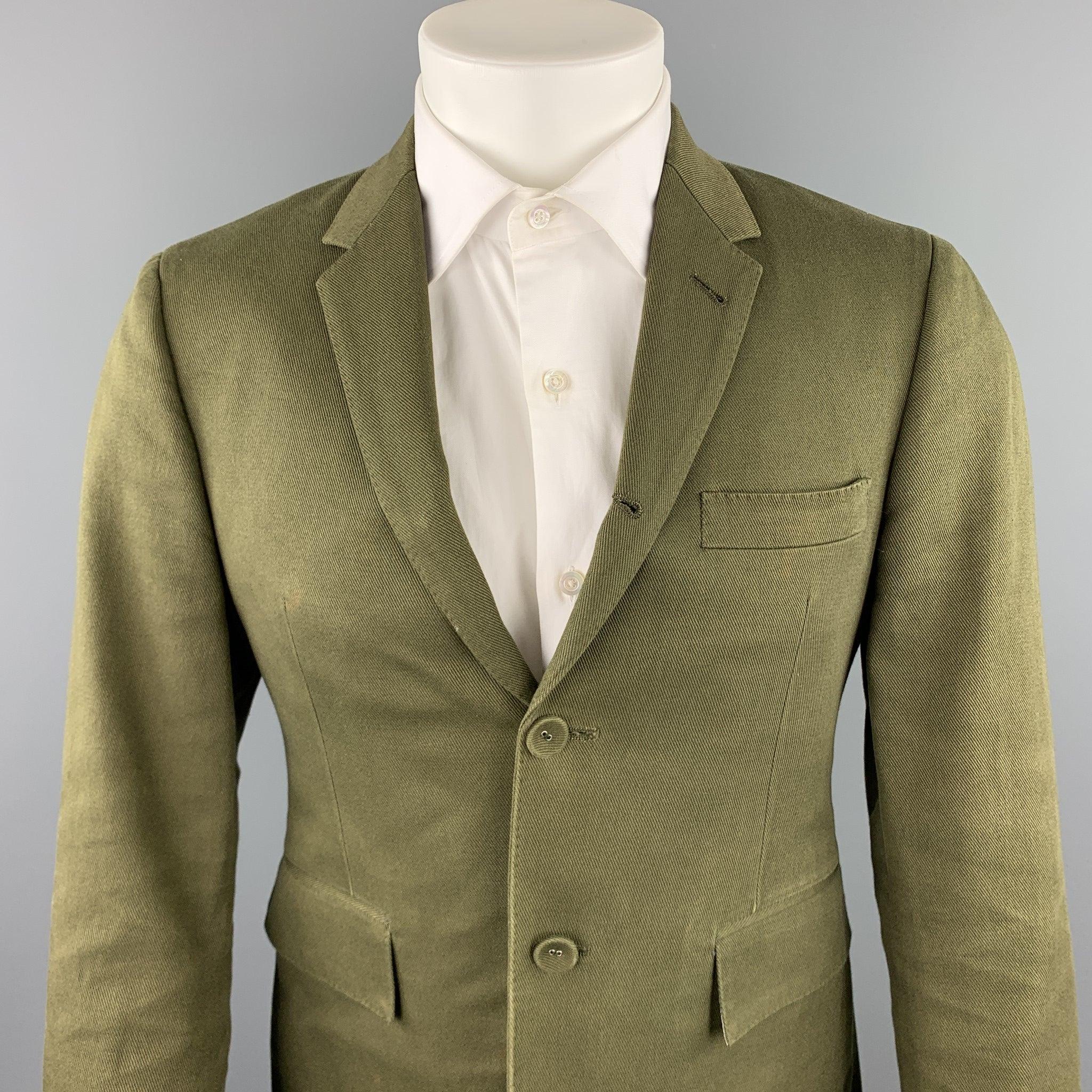 THOM BROWNE sport coat comes in a olive cotton with a full stripe liner featuring a notch lapel, flap pockets, and a two button closure. Minor discoloration. As-Is. Made in Japan.Good
Pre-Owned Condition. 

Marked:   1 

Measurements: 
 
Shoulder: