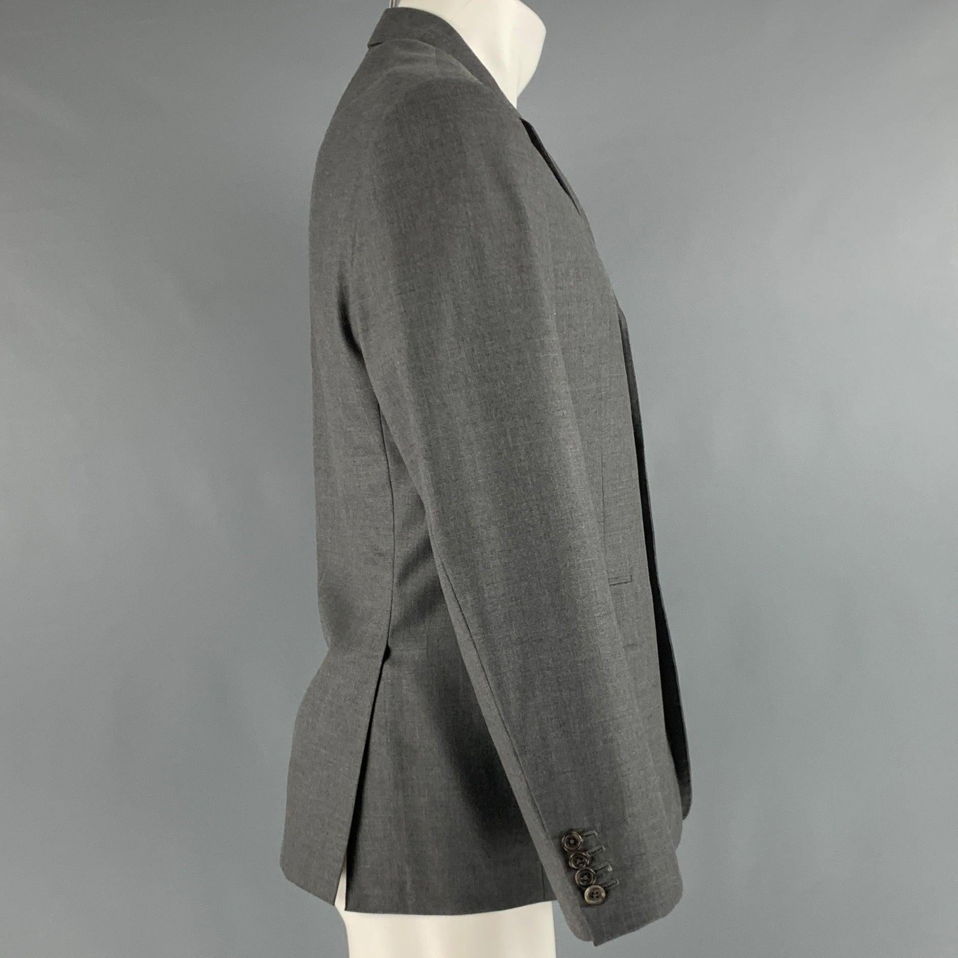 THOM BROWNE for BARNEYS sport coat
in a grey tweed featuring notch lapel, double vented back, and three button closure. Handmade in USA.Very Good Pre-Owned Condition. Minor signs of wear. 

Marked:   2 

Measurements: 
 
Shoulder: 16 inches Chest: