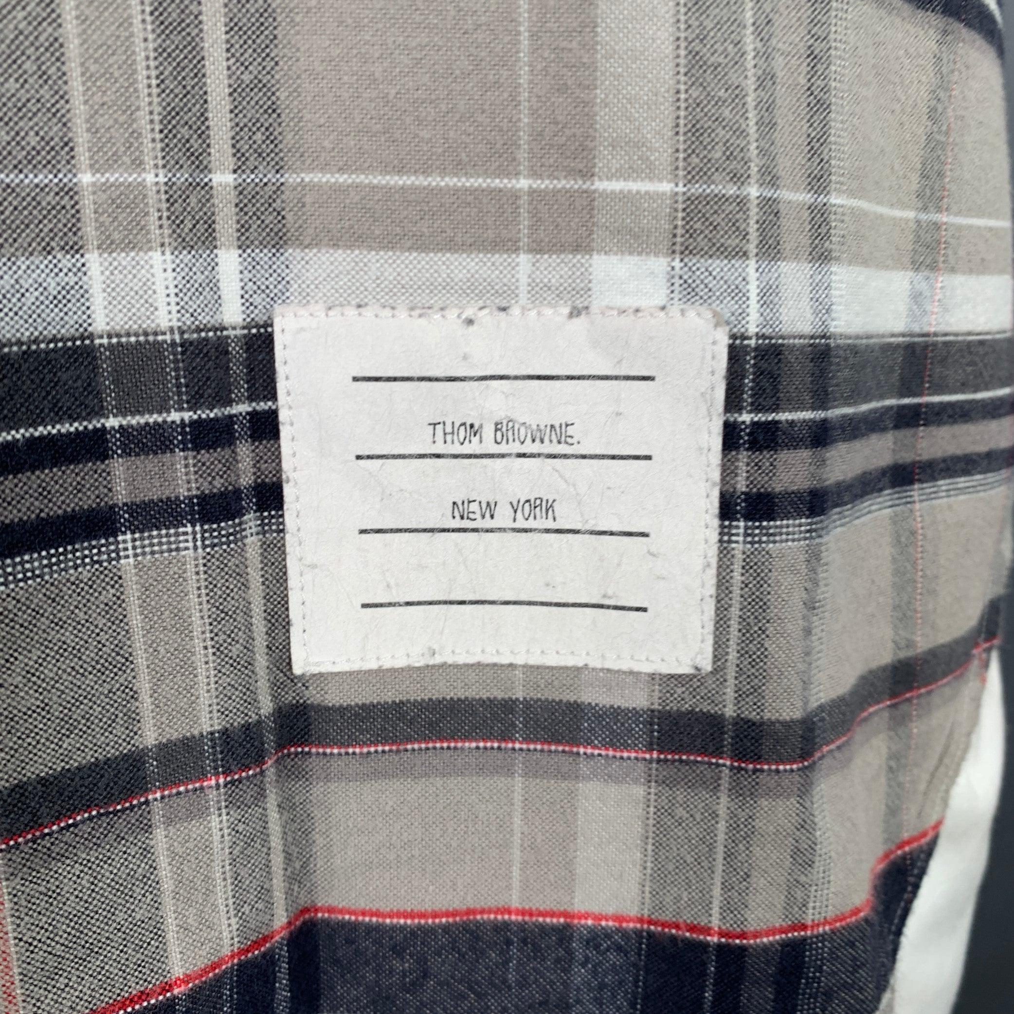 THOM BROWNE long sleeve shirt in a grey and taupe cotton woven fabric featuring a plaid pattern, button-down collar, one pocket, and button closure. Made in USA.Very Good
 Pre-Owned Condition. Moderate signs of wear. 

Marked:   3 

Measurements: 
