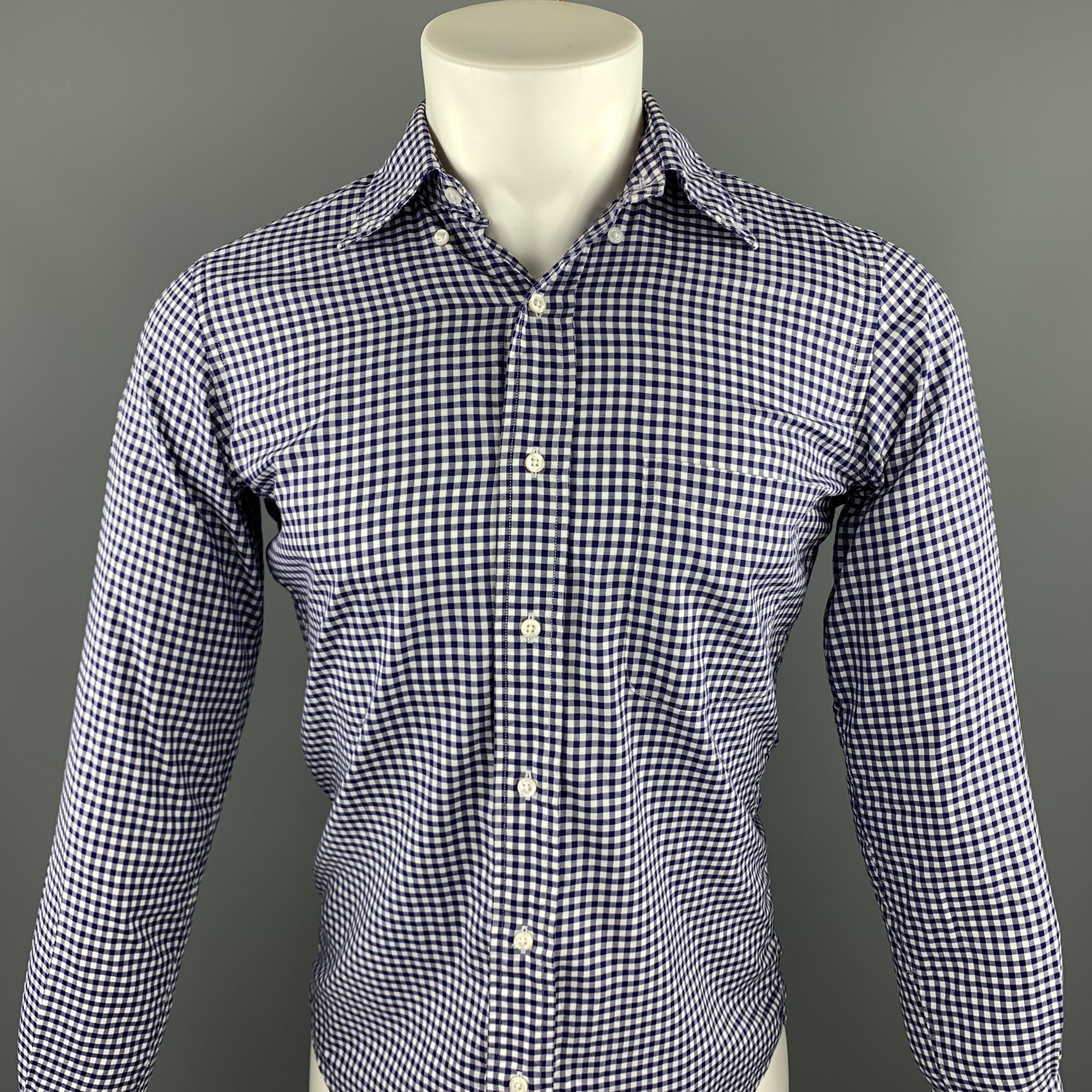 THOM BROWNE long sleeve shirt comes in a white & blue gingham cotton featuring a button down style and a front patch pocket. Made in USA.

Excellent Pre-Owned Condition.
Marked: 1

Measurements:

Shoulder: 14.5 in. 
Chest: 38 in.
Sleeve: 25 in.