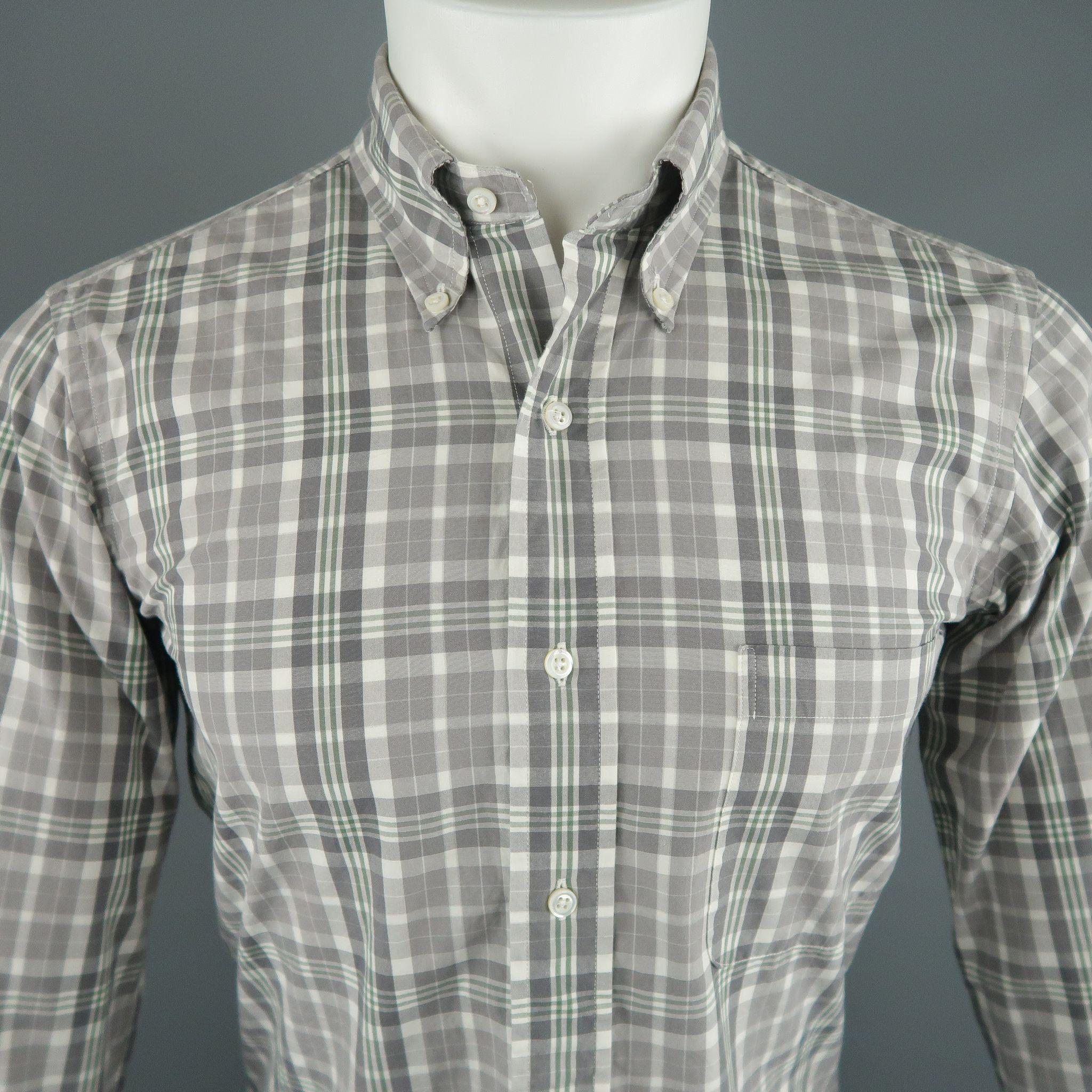 THOM BROWNE Long Sleeve Shirt comes in white, green and grey tones in a plaid cotton material, button down, with a front patch pocket and buttoned cuffs. Made in USA.

Excellent Pre-Owned Condition.
Marked: 1
 
Measurements:
 
Shoulder: 16