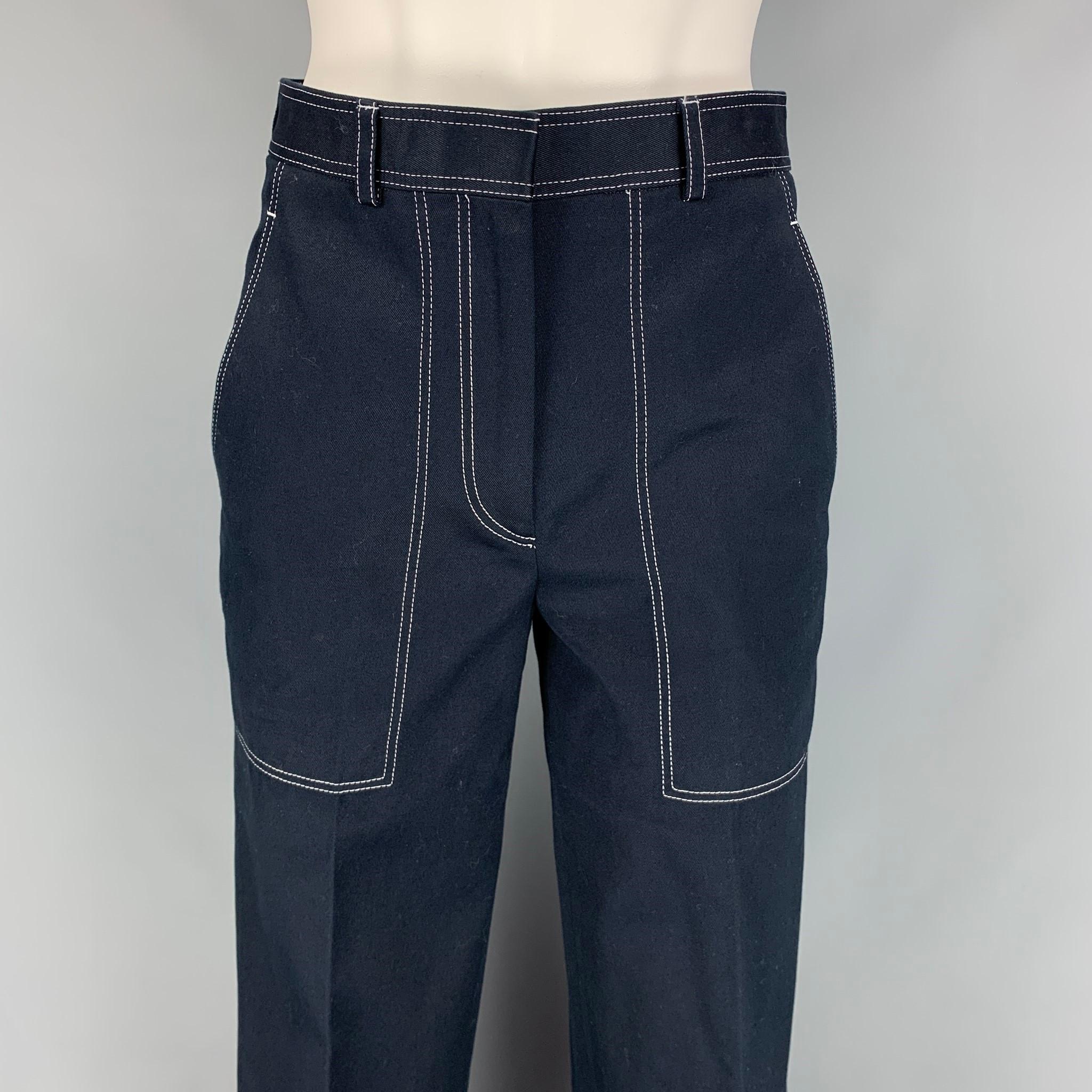 THOM BROWNE casual pants comes in a navy cotton featuring a high waist, cropped style, contrasts stitching, signature three-stripe logo, front tab, and a zip fly closure. Made in Italy. 

Excellent Pre-Owned Condition.
Marked: 36
Original Retail