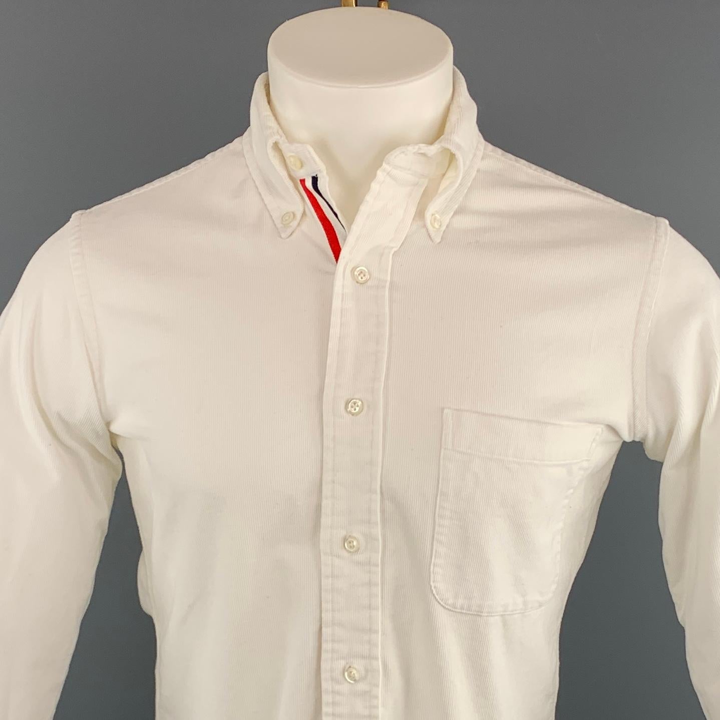 THOM BROWNE Long Sleeve Shirt comes in a white corduroy featuring a button down style and a front patch pocket. Made in USA. 

Excellent Pre-Owned Condition.
Marked: 1

Measurements:

Shoulder: 15 in.
Chest: 38 in. 
Sleeve: 24.5 in. 
Length: 29 in. 