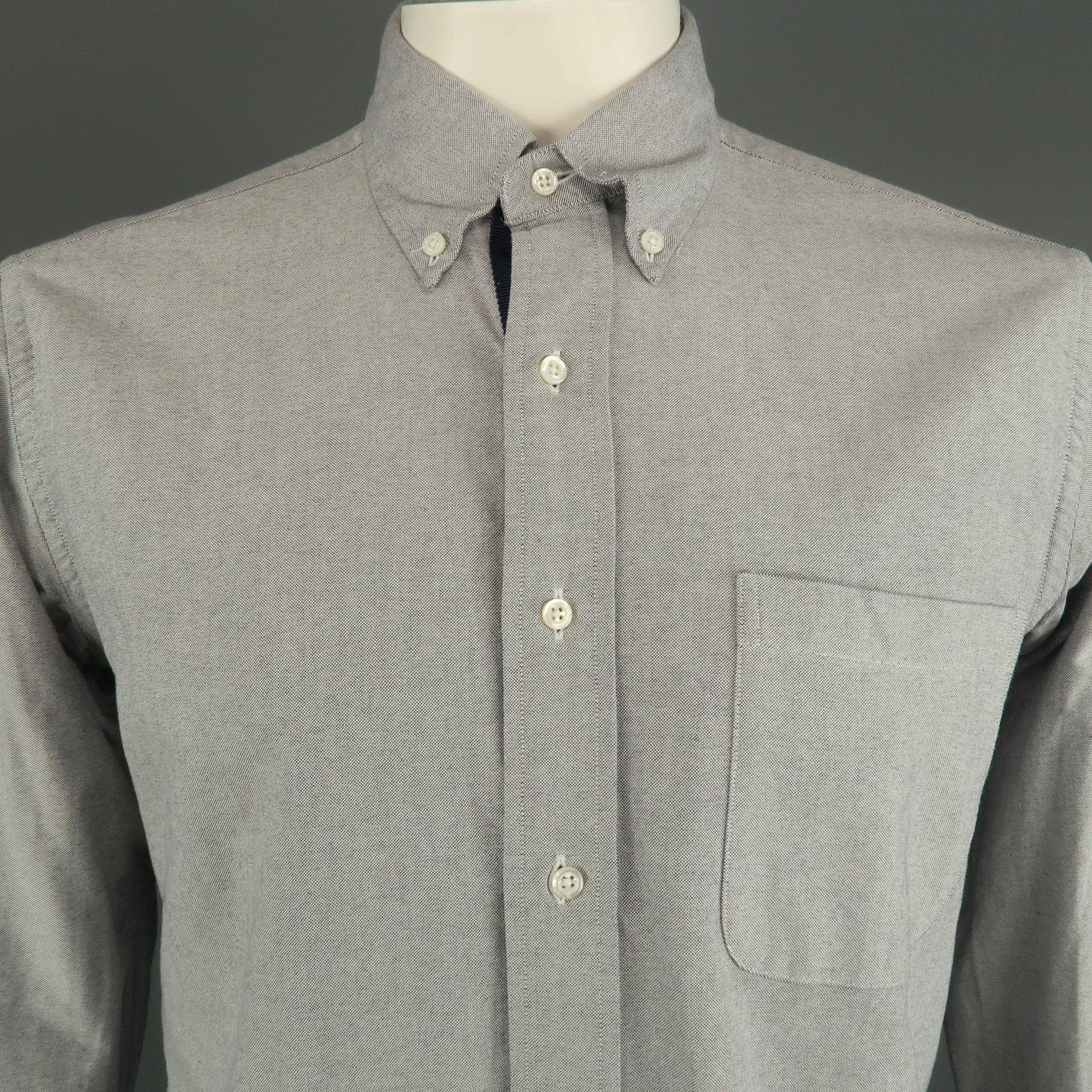 THOM BROWNE long sleeve shirt comes in a gray cotton featuring a inner navy trim, button down style, and a front patch pocket. Made in USA.
 
Excellent Pre-Owned Condition.
Marked: 4
 
Measurements:
 
Shoulder: 19 in.
Chest: 46 in.
Sleeve: 27