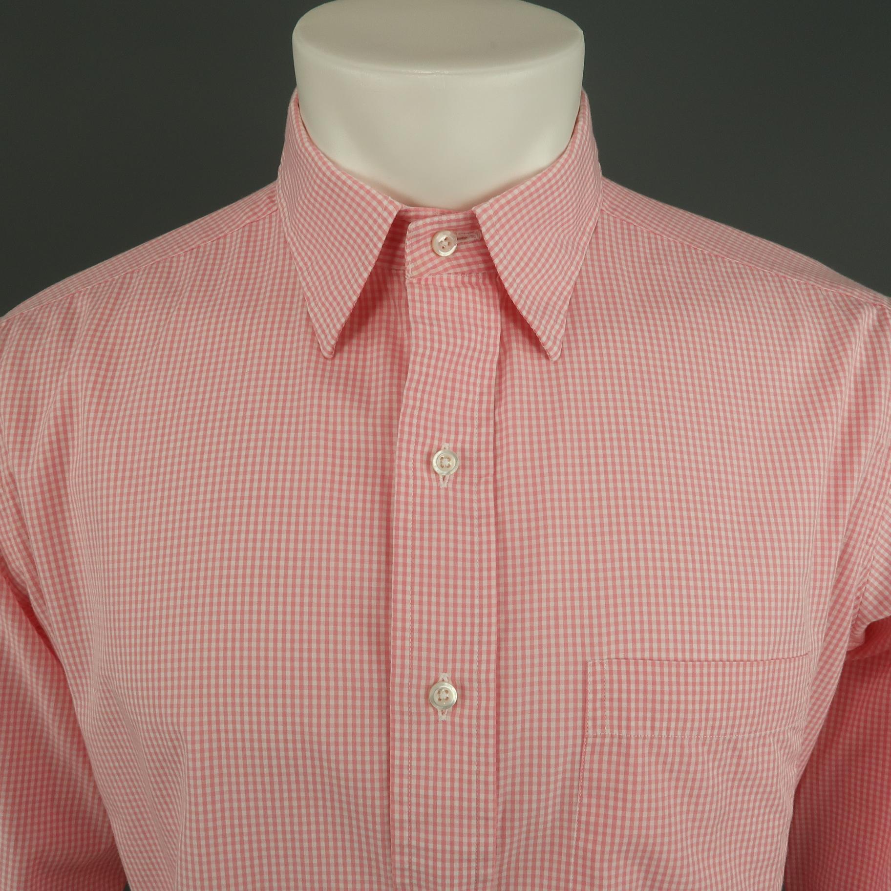 THOM BROWNE long sleeve shirt comes in a pink and white plaid cotton featuring a classic button up style, spread collar. and front patch pocket. Made in USA.
 
Excellent Pre-Owned Condition.
Marked: 4
 
Measurements:
 
Shoulder: 18.5 in.
Chest: 46