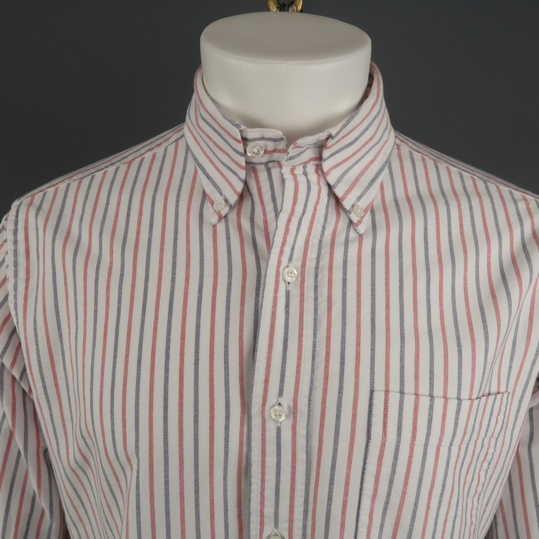 THOM BROWNE long sleeve shirt comes in a red, white, blue stripe cotton. Also, includes a classic button down collar and a front patch pocket. Made in USA.
 
Excellent Pre-Owned Condition.
Marked: 4
 
Measurements:
 
Shoulder: 18 in.
Chest: 48