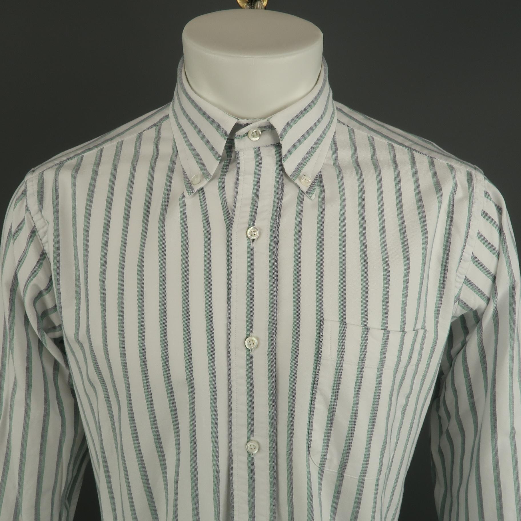 THOM BROWNE long sleeve shirt comes in a white and green stripe cotton featuring a button down collar style and a front patch pocket. Made in USA.
 
Excellent Pre-Owned Condition.
Marked: 4
 
Measurements:
 
Shoulder: 19 in.
Chest: 46 in.
Sleeve: