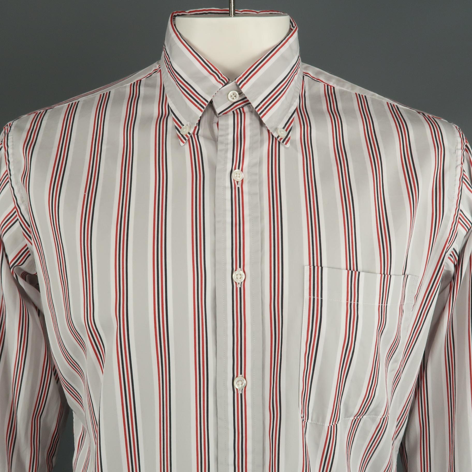 THOM BROWNE long sleeve shirt comes in a light gray striped cotton featuring a classic button down collar and a front patch pocket. Made in USA.

Excellent Pre-Owned Condition.
Marked: 5

Measurements:

l Shoulder: 18 in.
l Chest: 48 in.
l Sleeve: