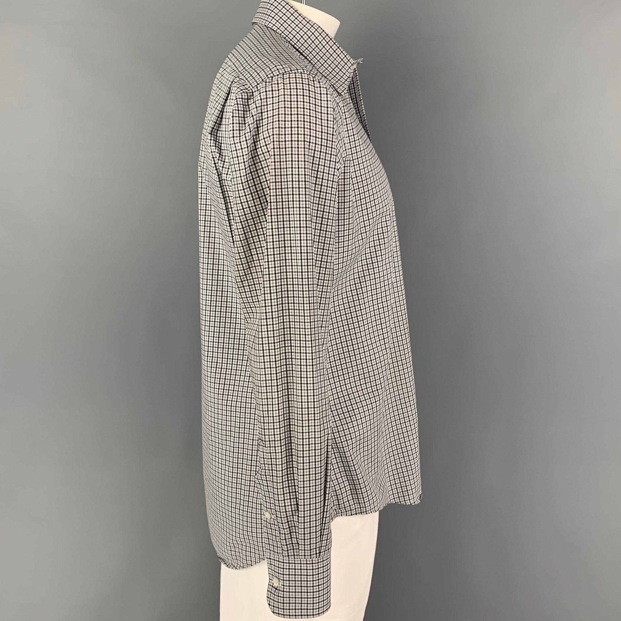 THOM BROWNE Spring 2009 long sleeve shirt comes in a white & black plaid cotton featuring a pointed collar, patch pocket, and a button up closure.
Very Good
Pre-Owned Condition. Light mark at sleeve. As-is.  

Marked:   5 

Measurements: 

