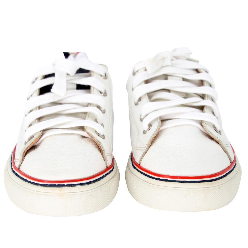 Thom Browne Two Tone 36 Calfskin Leather Low Top Sneakers TB-1109P-0009

For the casual fashionista, this Thom Browne Calfskin Leather Men's low top Sneakers are a classic style with a chic detail. These shoes feature leather detail with two tone