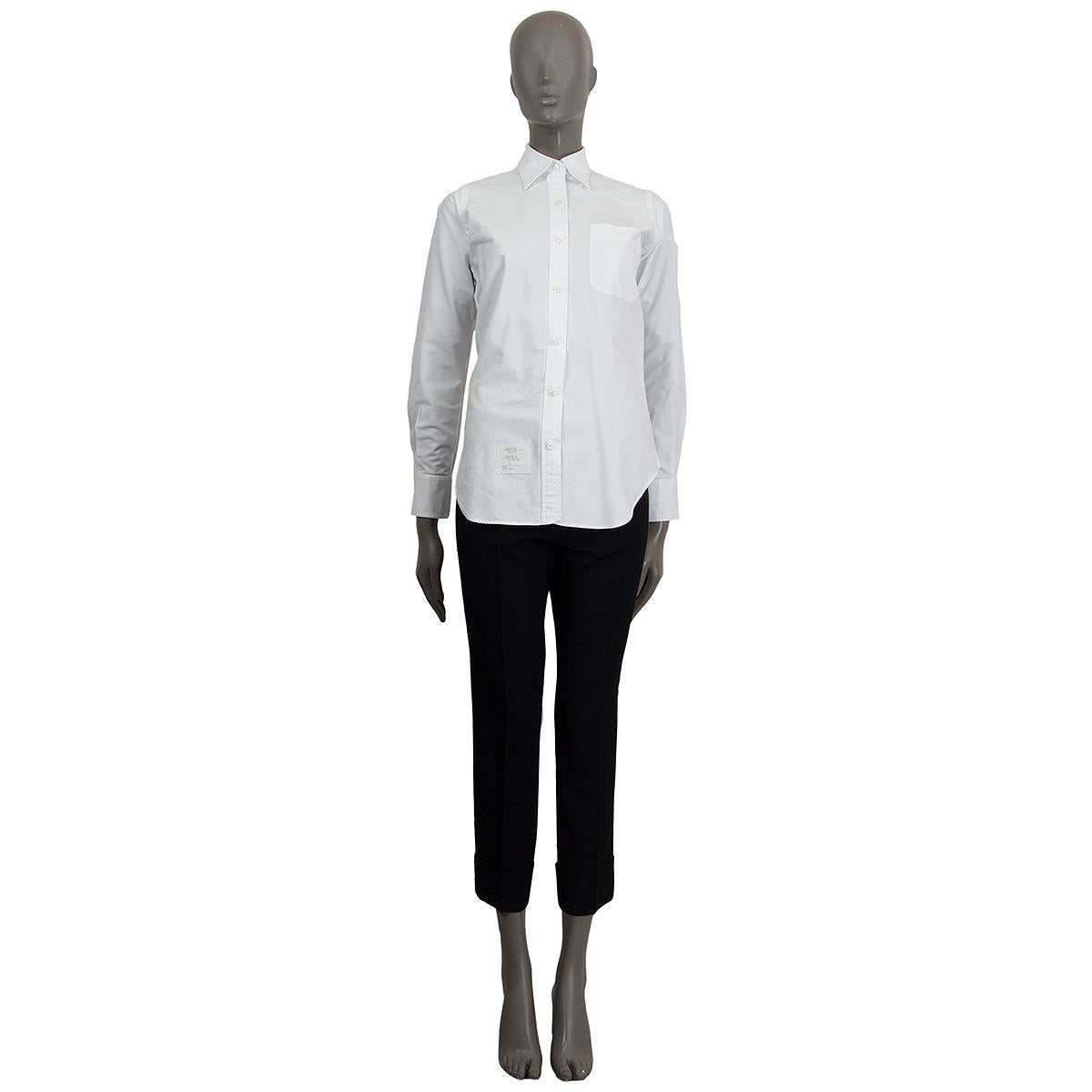 100% authentic Thom Browne button-down shirt in white cotton (100%) with a pointed collar and one chest pocket. Closes on the front with buttons. Unlined. Has been worn and is in excellent condition.

Measurements
Tag Size	1
Size	XS
Shoulder