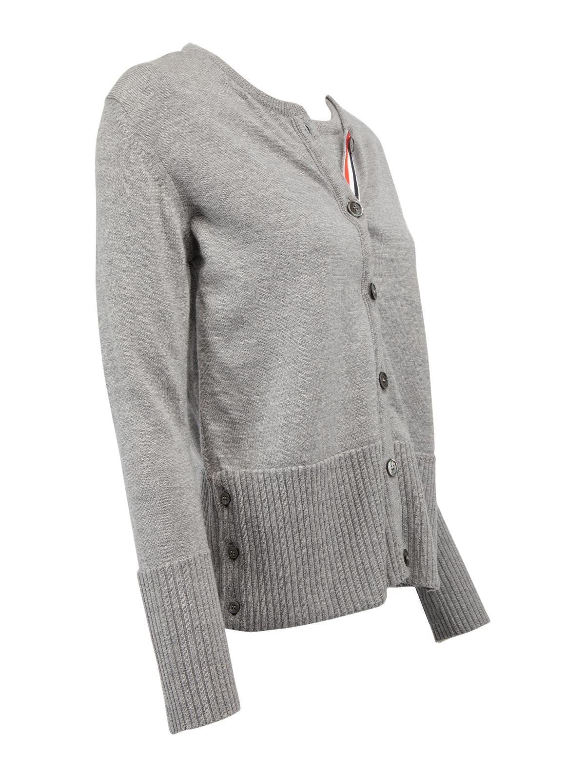 CONDITION is Never worn with tags. No wear and pilling to cardigan is evident on this used Thom Browne designer resale item. Details Grey Wool and rayon Cardigan Form fitting Long sleeve Round neck Attached inner vest Button fastening Made in Italy