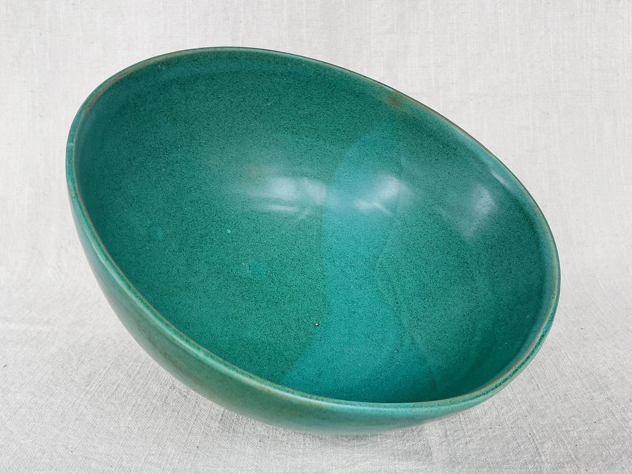 From Thom Lussier's oxidized copper collection - a series of ceramic vessels that stand out for their brilliant palette and rich textures. This bowl is safe for food.

White stoneware with cone 6 glaze.

Dimensions:
11.25 in. width
11.4 in.