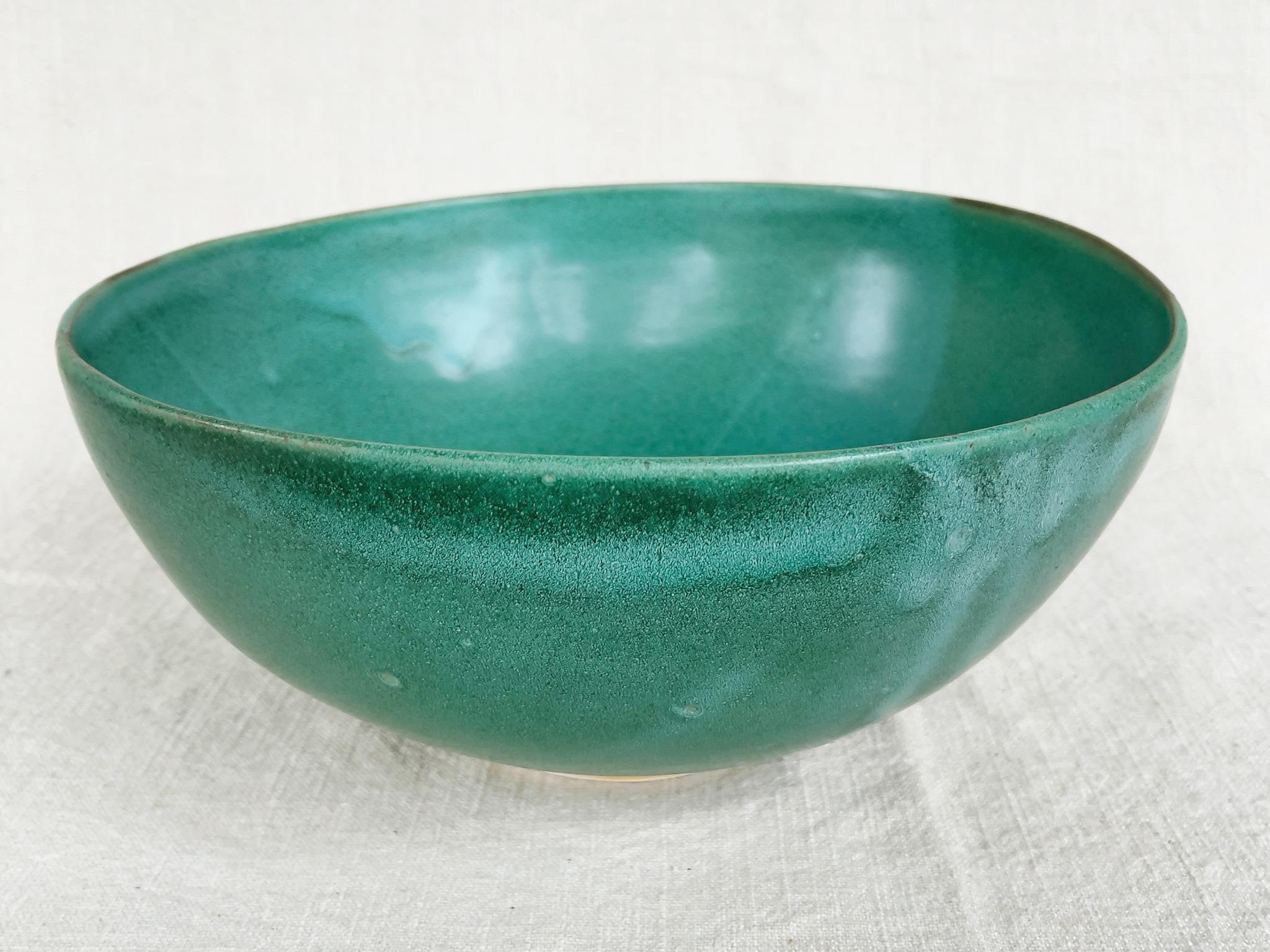 From Thom Lussier's Oxidized Copper Collection - a series of ceramic vessels that stand out for their brilliant palette and rich textures. This bowl is safe for food.

White stoneware with Cone 6 glaze.

Dimensions:
12 in. width
11.5 in. depth
5 in.