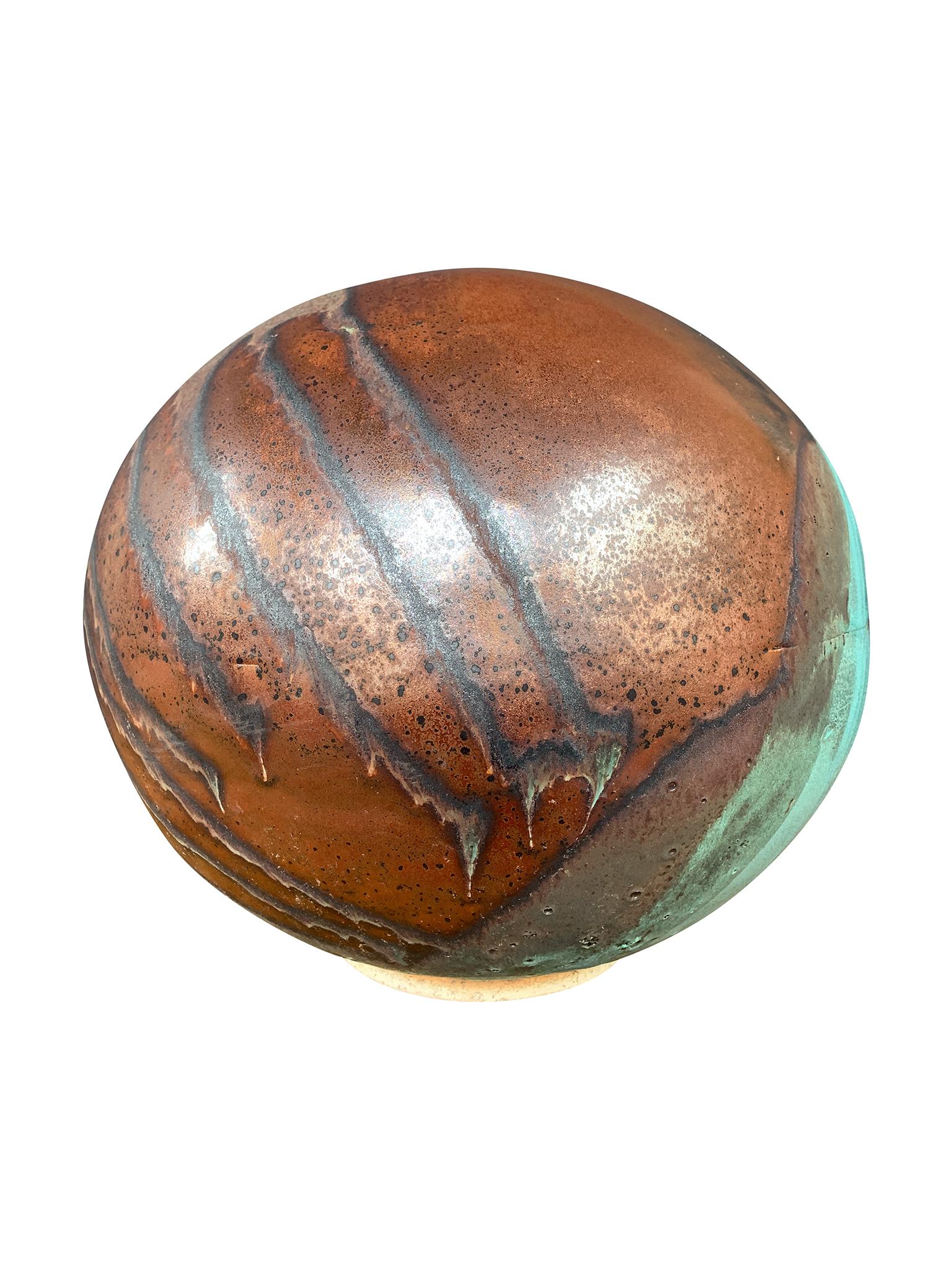 From Thom Lussier's Oxidized Copper Collection - a series of ceramic vessels that stand out for their rich textures and brilliant palette of copper and turquoise. This vessel is spherical in form with a wide opening.

White stoneware, midfire