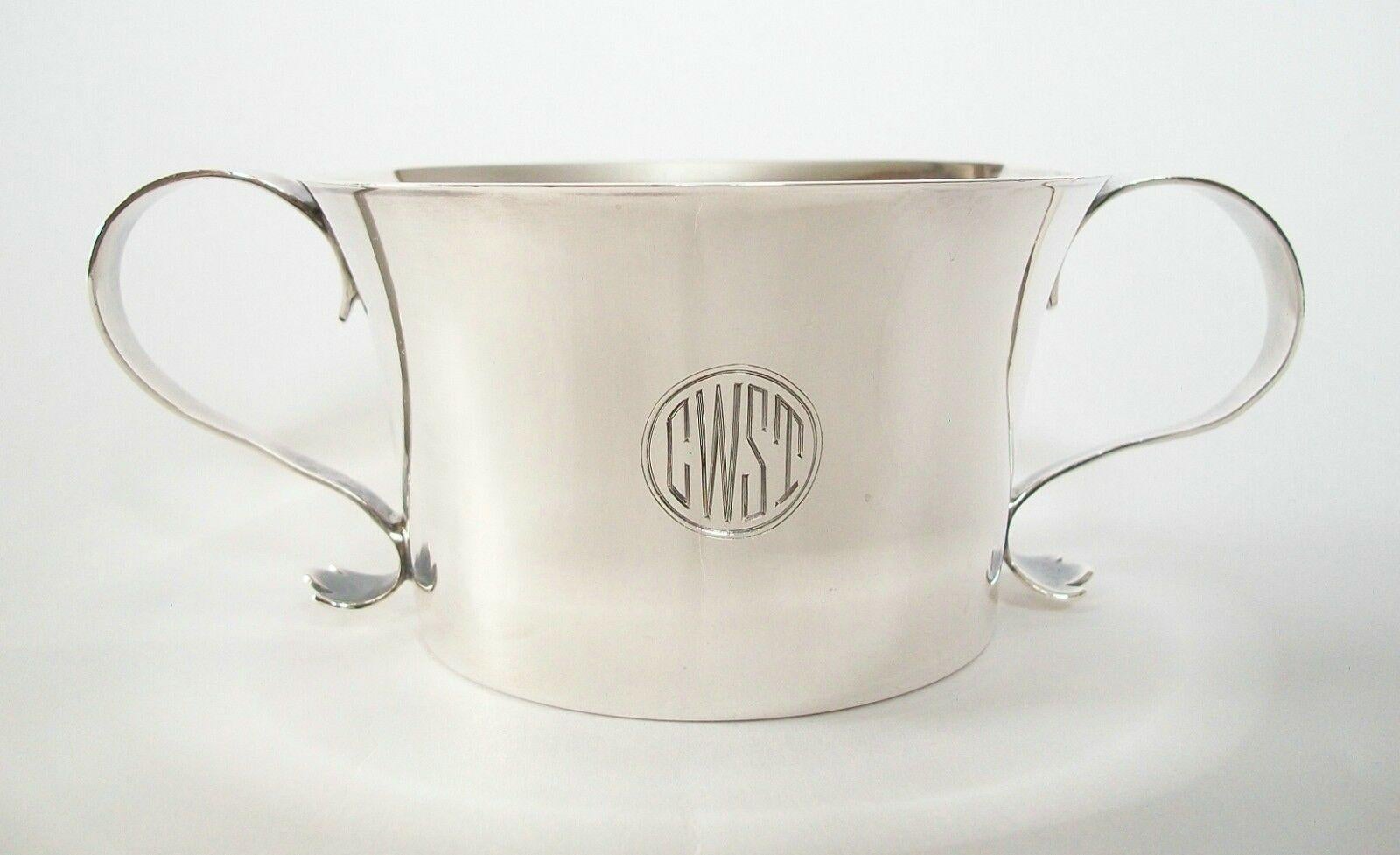 THOMAS BRADBURY & SONS (Sheffield) - Fine quality Art Deco Britannia silver twin handled Christening cup - gently sloping sides - S shaped handles - 'CWST' Art Deco monogram within a circular cartouche - engraved date of July 2nd, 1927 on the bottom