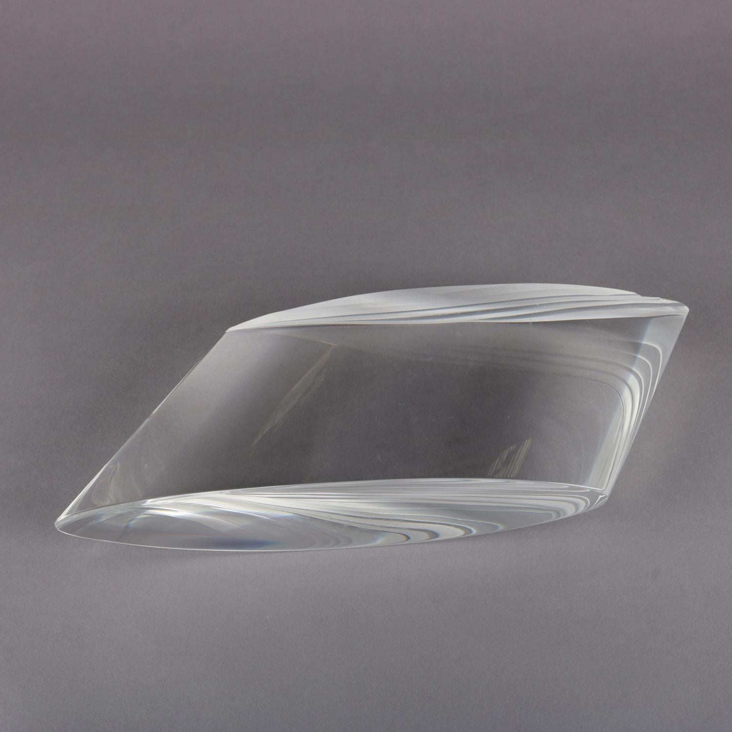 Contemporary Thomas Brzon art glass sculpture features polished optic glass oblique cylinder with concave top surface, signed along bottom Brzon Thomas, 20th century

Measures: 5