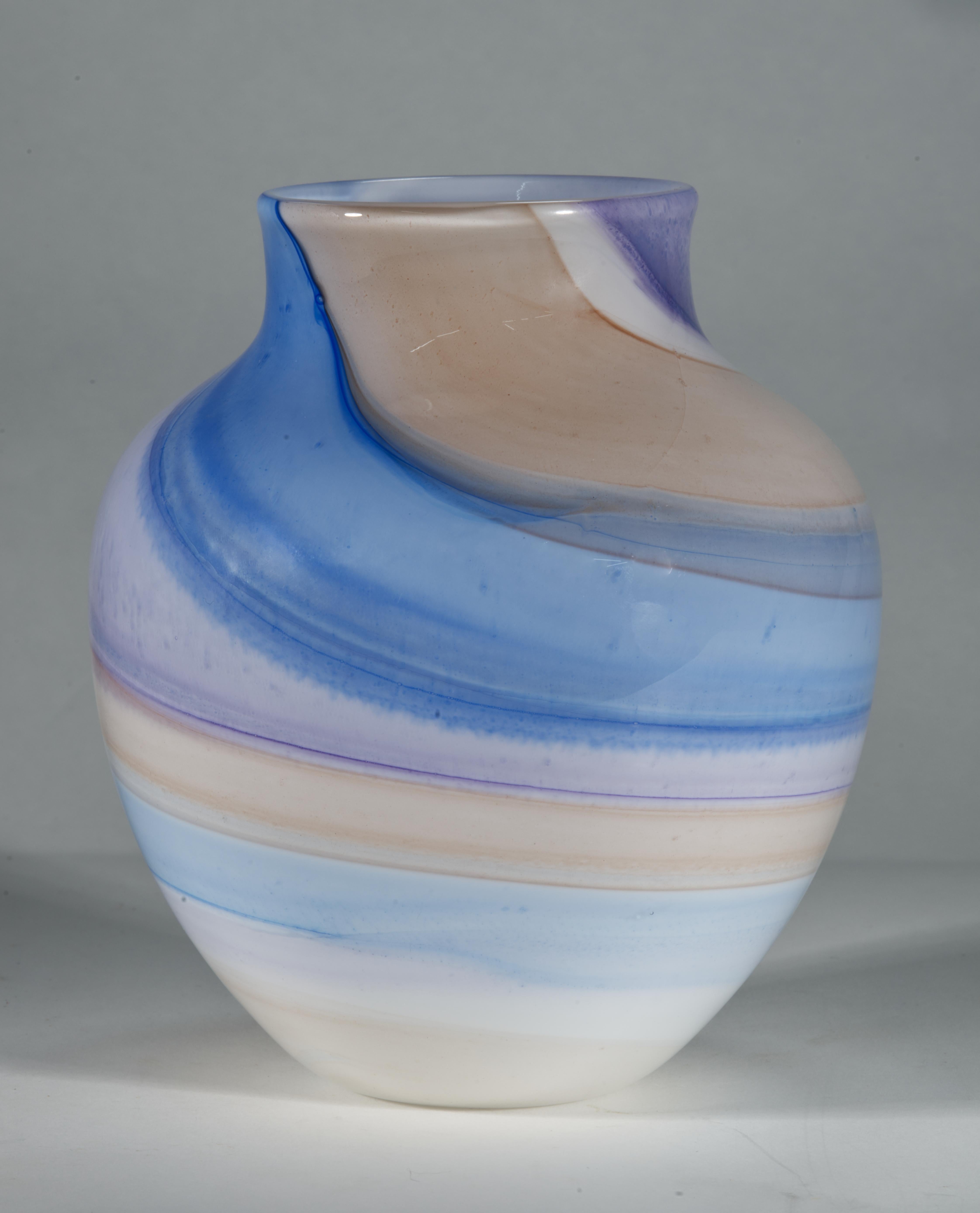  Sculptural Organic Modern vase was hand blown with thin layer of white glass underlying the multicolored fused glass. The abstract, graphic pattern of soft, pastel purple, off-white, coral-yellow, and bright, more prominent cobalt and light blue