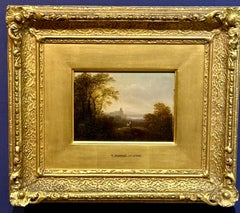 19th century English classical landscape with trees, a castle and a lake