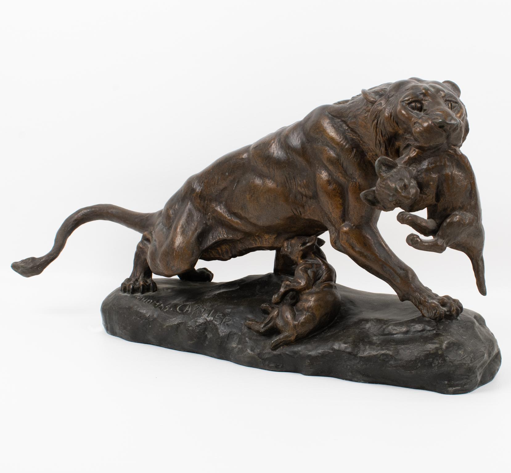 Thomas Francois Cartier (1879 - 1943) designed this spectacular cast spelter sculpture during the Art Deco period in France in the 1920s. The artwork features a lioness with two cubs. This artwork design is refined and powerful, showing the