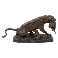 Thomas Cartier Art-Déco-Skulptur einer Löwe mit Würfeln aus Bronze, Bronzebemalt aus Zinn, Art déco