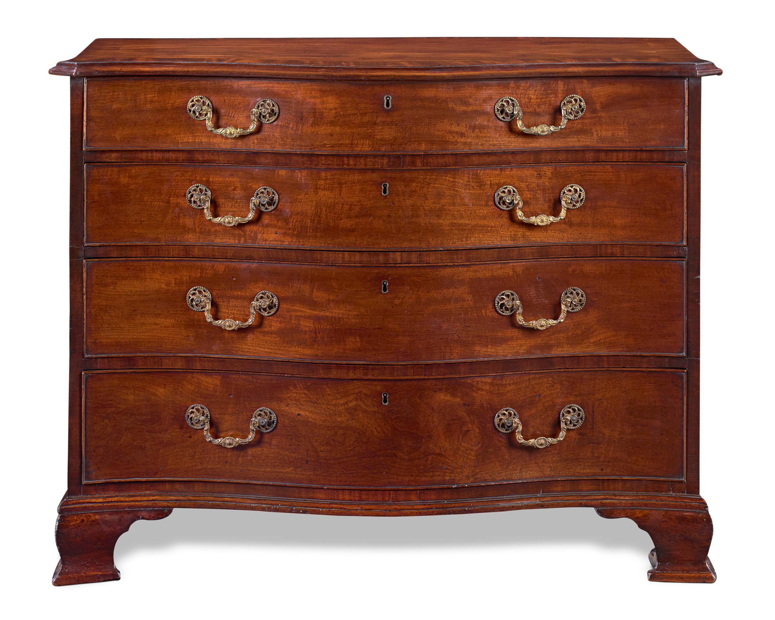 This incredibly rare serpentine-front chest of drawers is attributed to the iconic Thomas Chippendale and is counted as one of the few examples in existence made by his hand. An unquestionable masterpiece, this mahogany dresser is complete with its