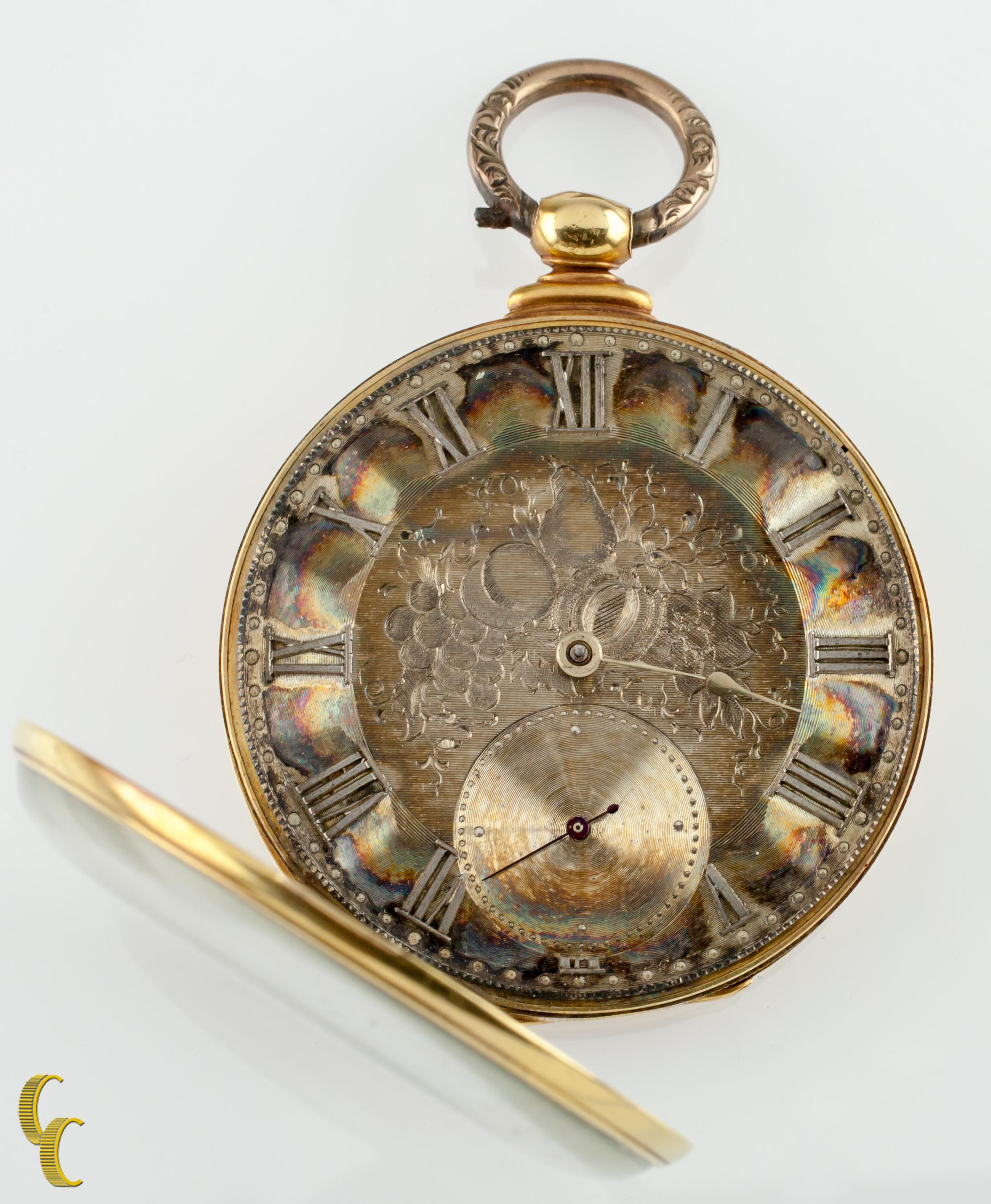 Beautiful Antique Thomas Cooper of London Pocket Watch w/ Amazing Machine-Etched Dial
Dial has acquired a rich rainbow colored patina over the years.
18k Yellow Solid Gold Case w/ Intricate Feather Design on Reverse of Case
Silver Roman