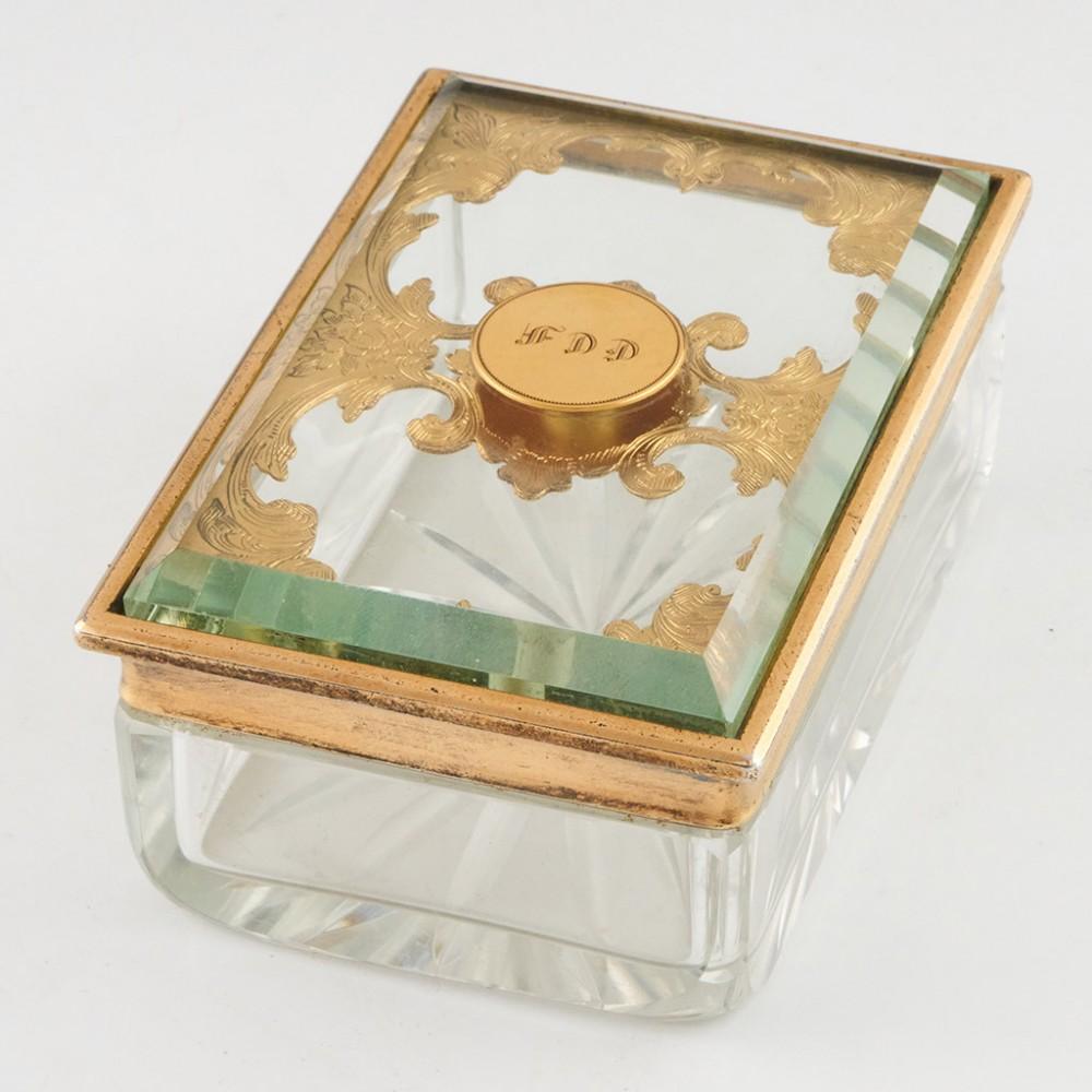Thomas Diller Glass Trinket Box with Gilt Sterling SIlver Cover, 1837

Additional information:
Date : Hallmarked between the 20th of May and the 20th of June in 1837. The makers mark is that of Thomas Diller
Period : William IV 
Origin : London,