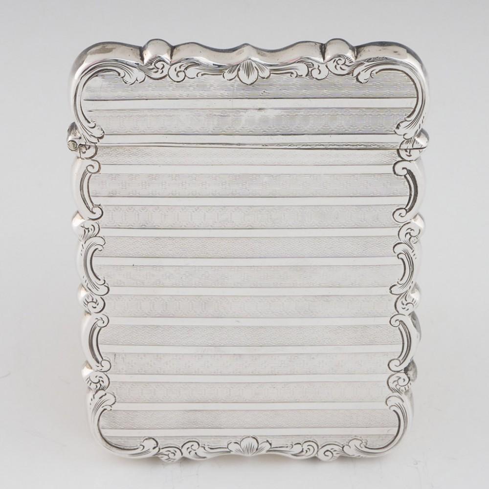 Heading : Thomas Dones sterling silver card case
Date : Hallmarked in Birmingham in 1850 for Thomas Dones
Period : Victoria
Origin : Birmingham, England
Decoration : Alternating  bands of tooled geometric patterns separated by bands of plain silver.