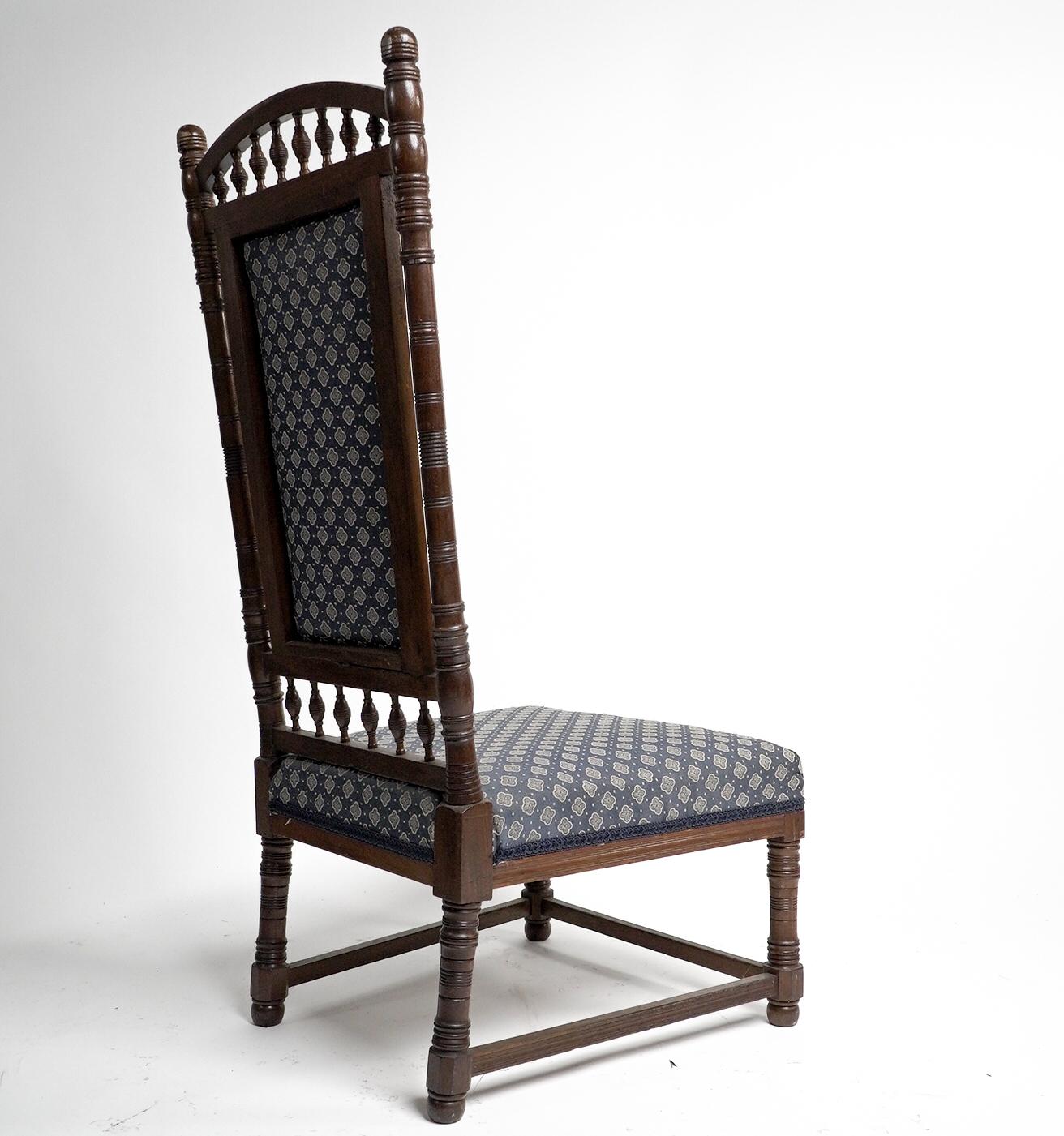 English T E Collcutt for Collinson & Lock. An Aesthetic Movement walnut high back chair. For Sale