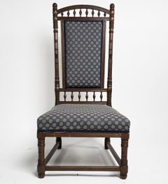 Antique T E Collcutt for Collinson & Lock. An Aesthetic Movement walnut high back chair.