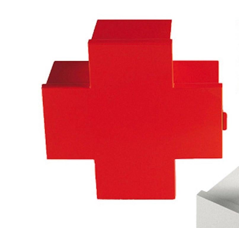 Designed to store medicine, the cross cabinet by Thomas Eriksson is wall-hanging, available with a glossy varnished finish, in red, orange, green, blue and white. Made of laser-cut and folded sheet metal, the doors of the cross cabinets fasten with