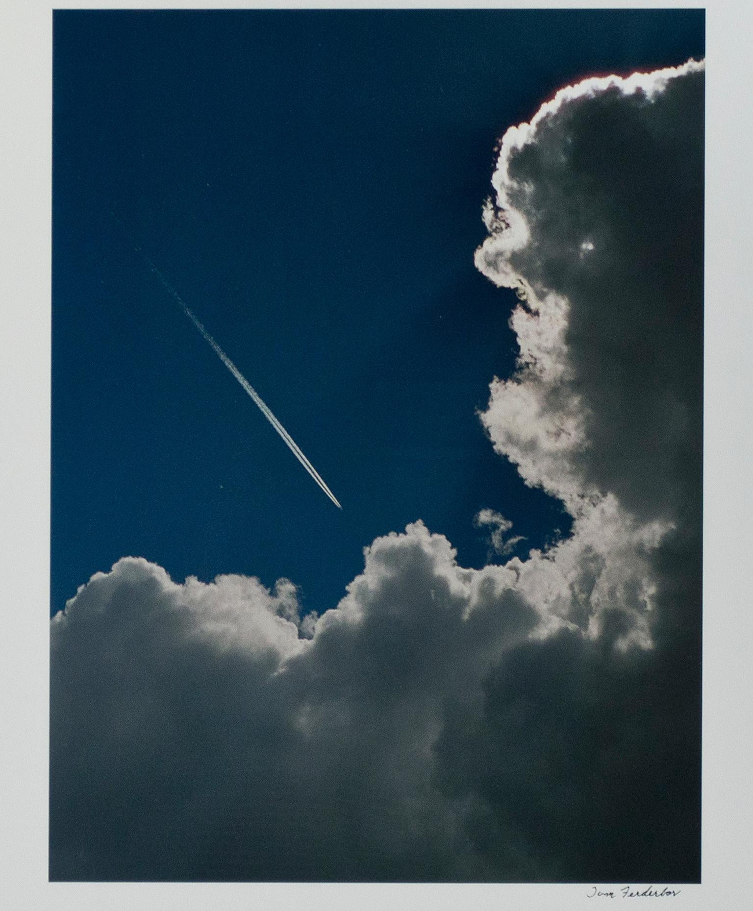 "Plane Into Cloud, AZ" is an original color photograph by Thomas Ferderbar. The artist signed the piece lower right. It depicts an airplane flying towards a large, fluffy cloud. 

20 1/4" x 15" image
26" x 21" paper
29" x 24" frame

I wanted to