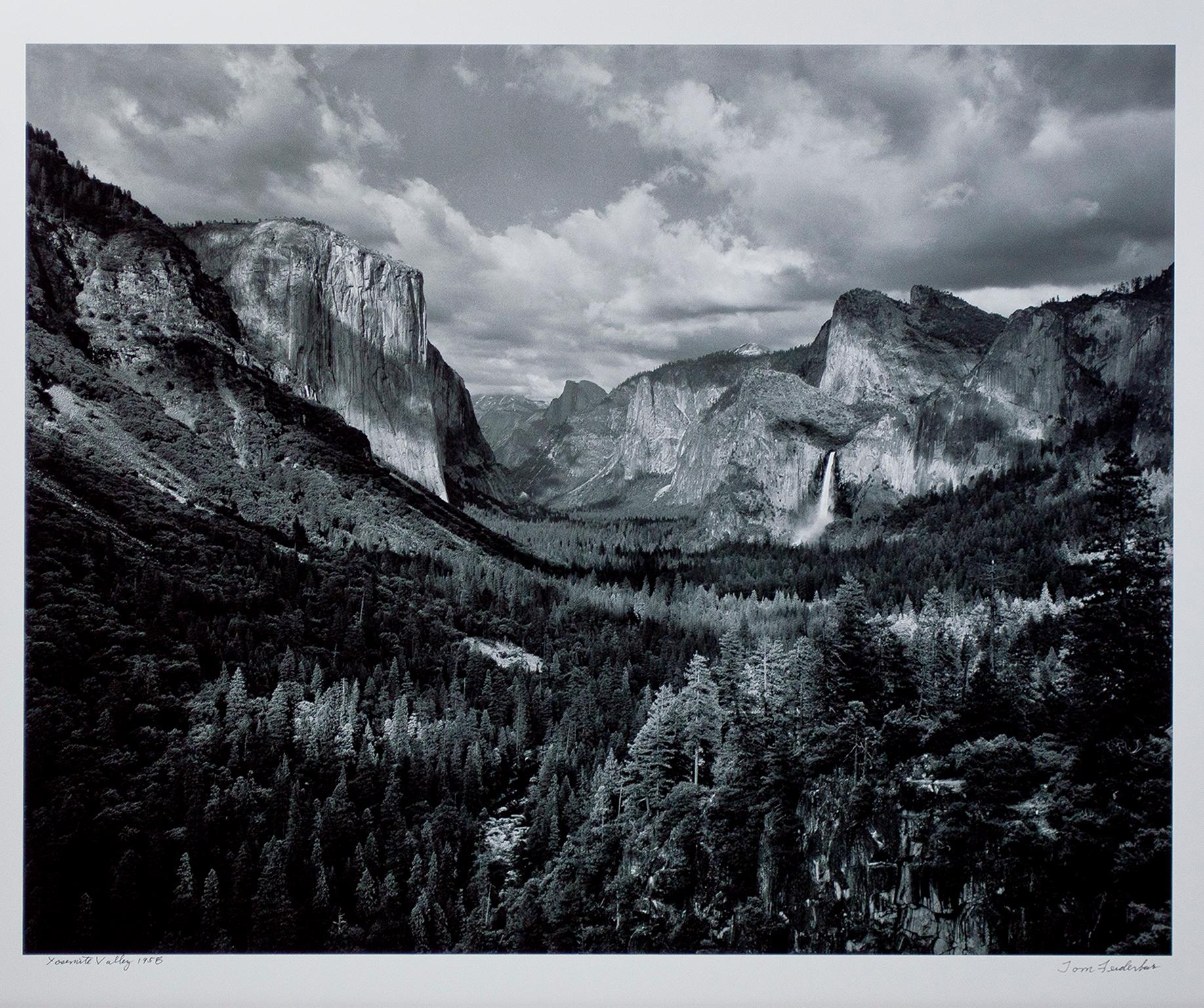 "Yosemite Valley" is an original black and white photograph by Thomas Ferderbar. The artist signed the piece lower right and titled it lower left. It depicts an expansive landscape with mountains, forests, and cliffs. 

28 1/2" x 35" image
38" x 45"