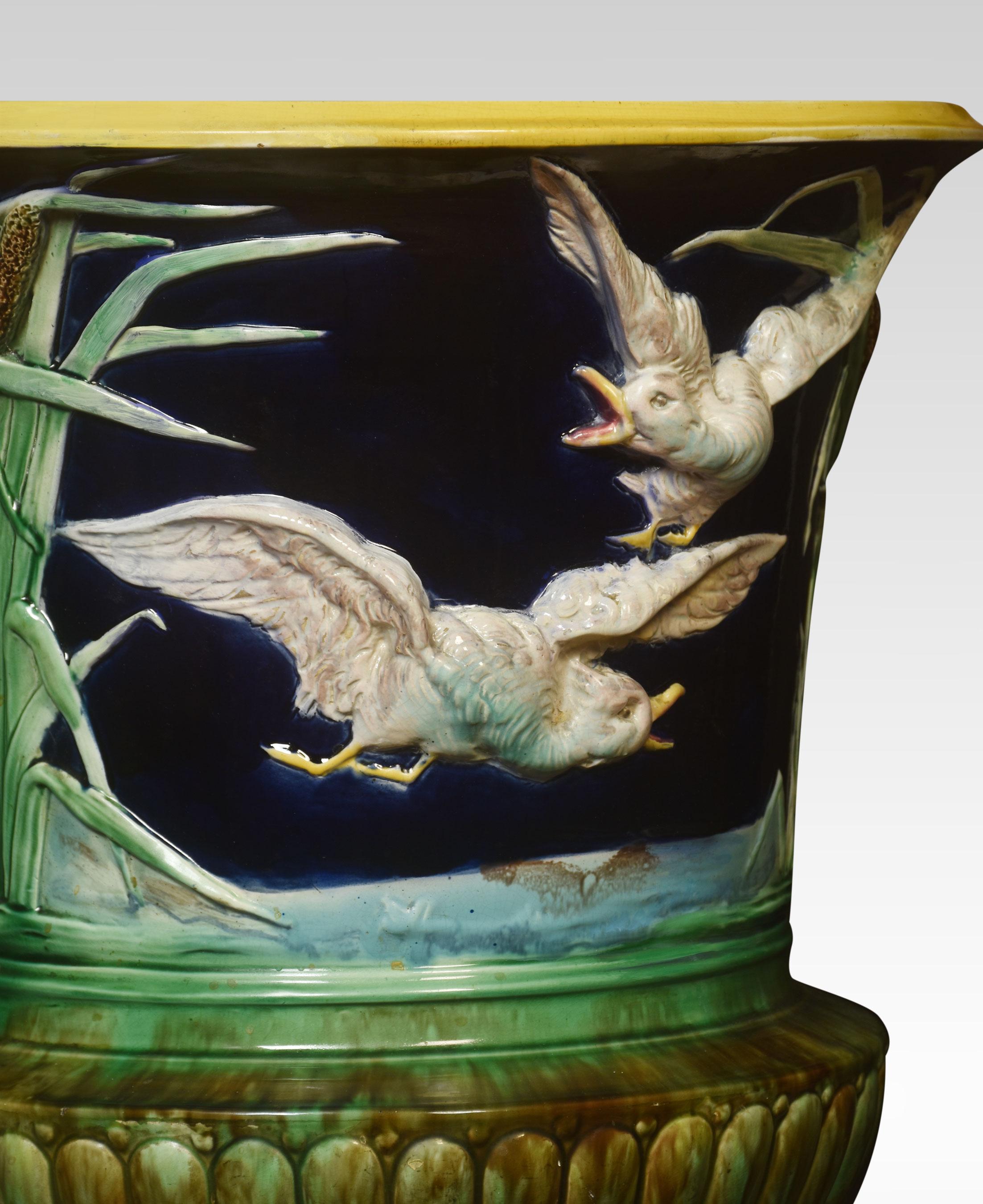 Thomas Forrester Majolica Jardiniere. Decorated with High-Relief very detailed painted birds and dogs with blue background. Raised up on paw feet.
Dimensions
Height 23 inches
Width 20.5 inches
Depth 20.5 inches.