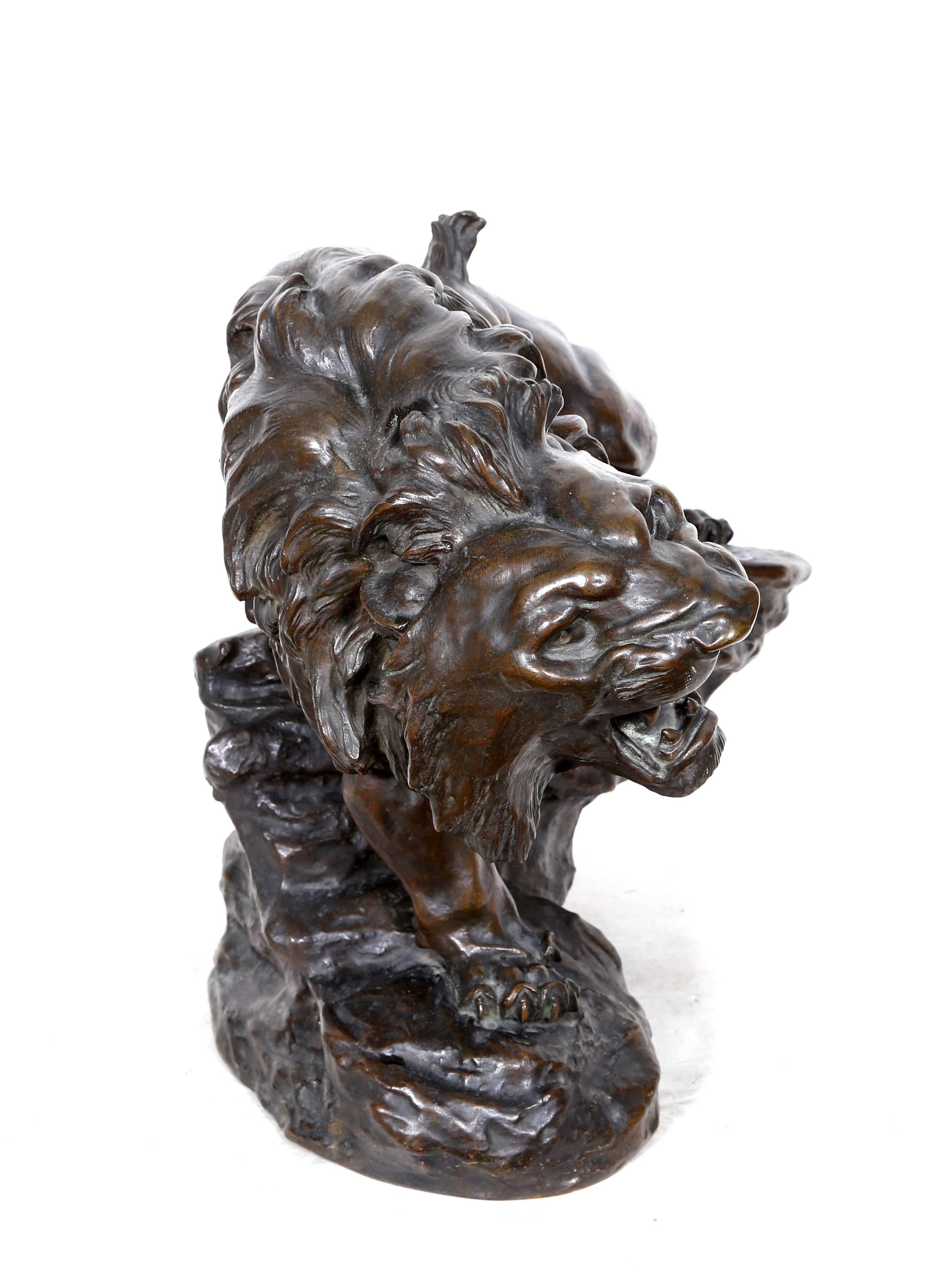 Artist: Thomas-Francois Cartier (After), French (1879 - 1943)
Title: Snarling Lion
Medium:	Bronze Sculpture, signature inscribed
Size:	17  x 18.5  x 13 in. (43.18  x 46.99  x 33.02 cm)