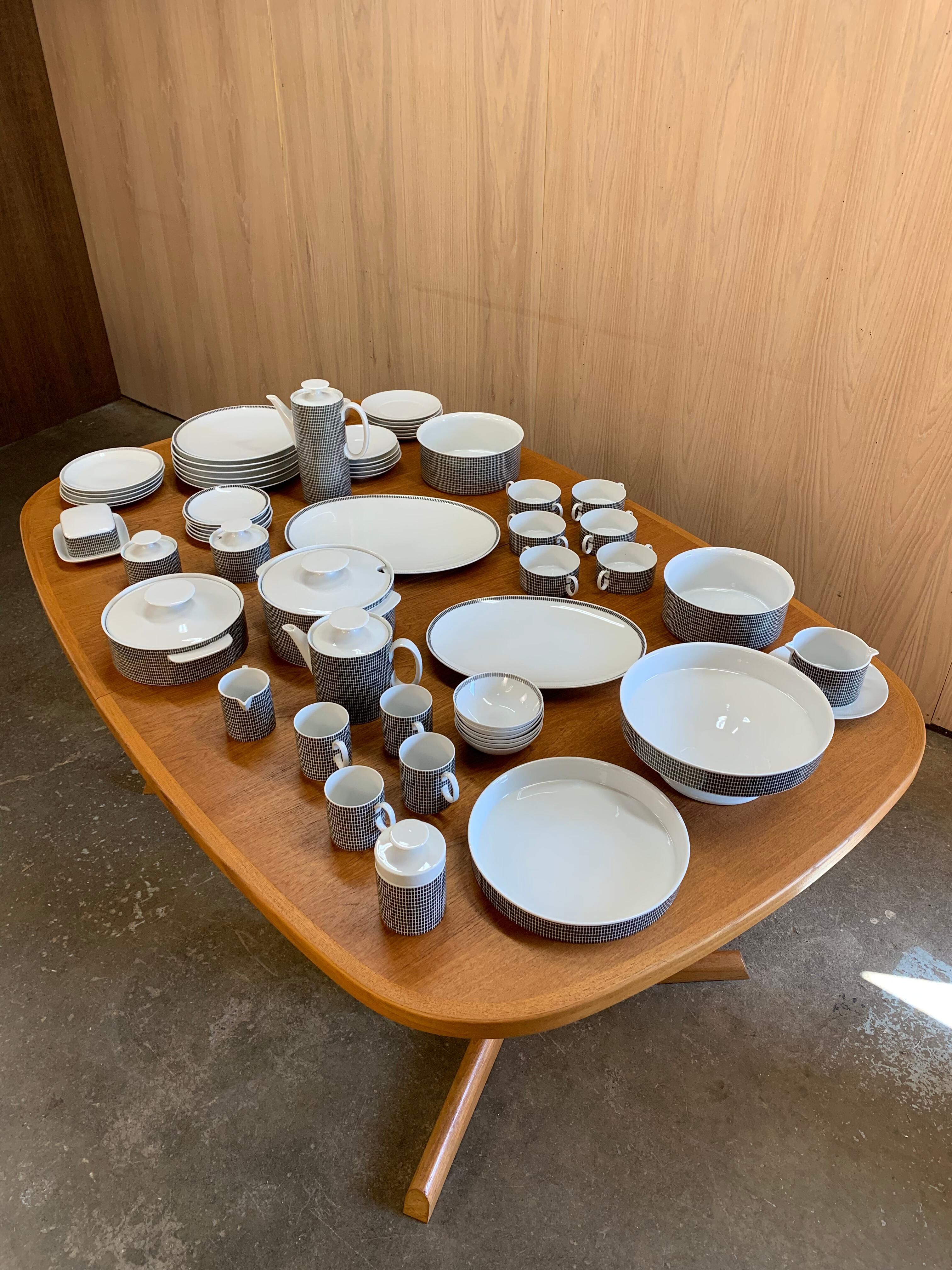 A striking and sculptural porcelain dinnerware set from Thomas Germany, featuring the iconic Onyx Grey pattern—an elegant grid of deep charcoal on crisp white, designed in the 1960s and still effortlessly modern today.

This is a rare, near-complete