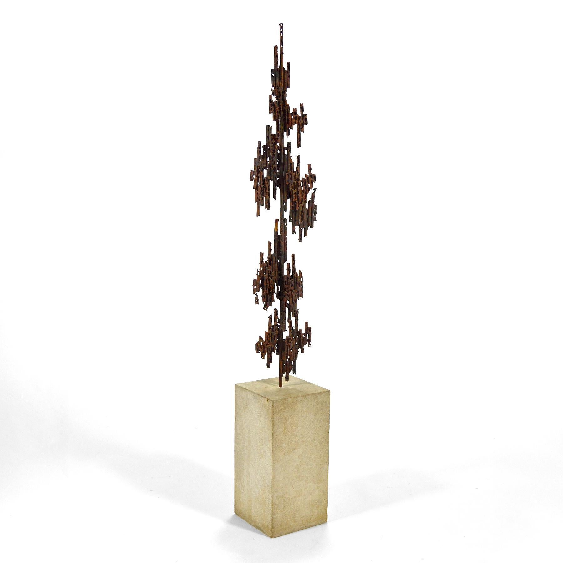 A powerful and dynamic sculpture by Chicago area artist Thomas Hibben, this piece of torch cut and welded copper is mounted on a cement pedestal of the artist's making. The work has qualities which remind us of Fantoni and Bertoia.

This piece