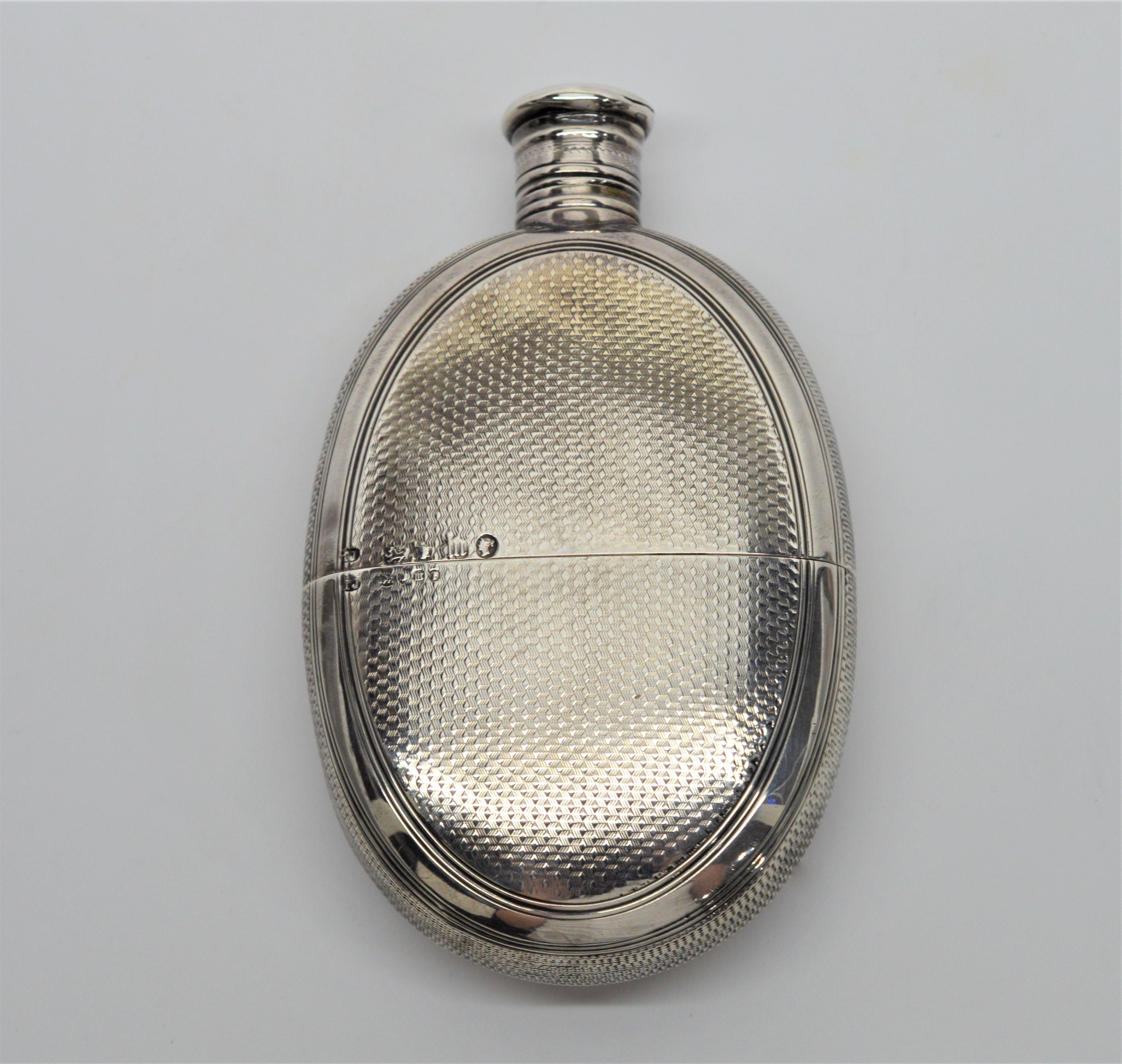 A great find! Sterling Silver Antique English Victorian Flask 4-7/8 x 3 inches. Removable bottom forms cup. Personalized.  In mint condition. 
Maker Thomas Johnson, London 1867. 
  