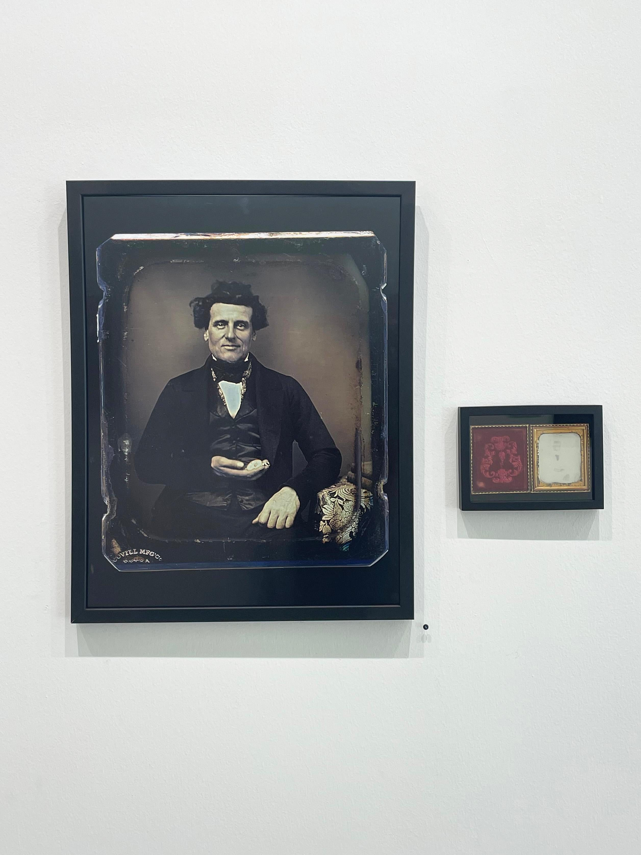 *Listing includes framed archival pigment print and daguerreotype

Man with Pocket Watch by Thomas Kennaugh is an enlarged and enhanced print of a daguerreotype made in 1855. The original daguerreotype measures approximately 3.5 x 3 inches, and is