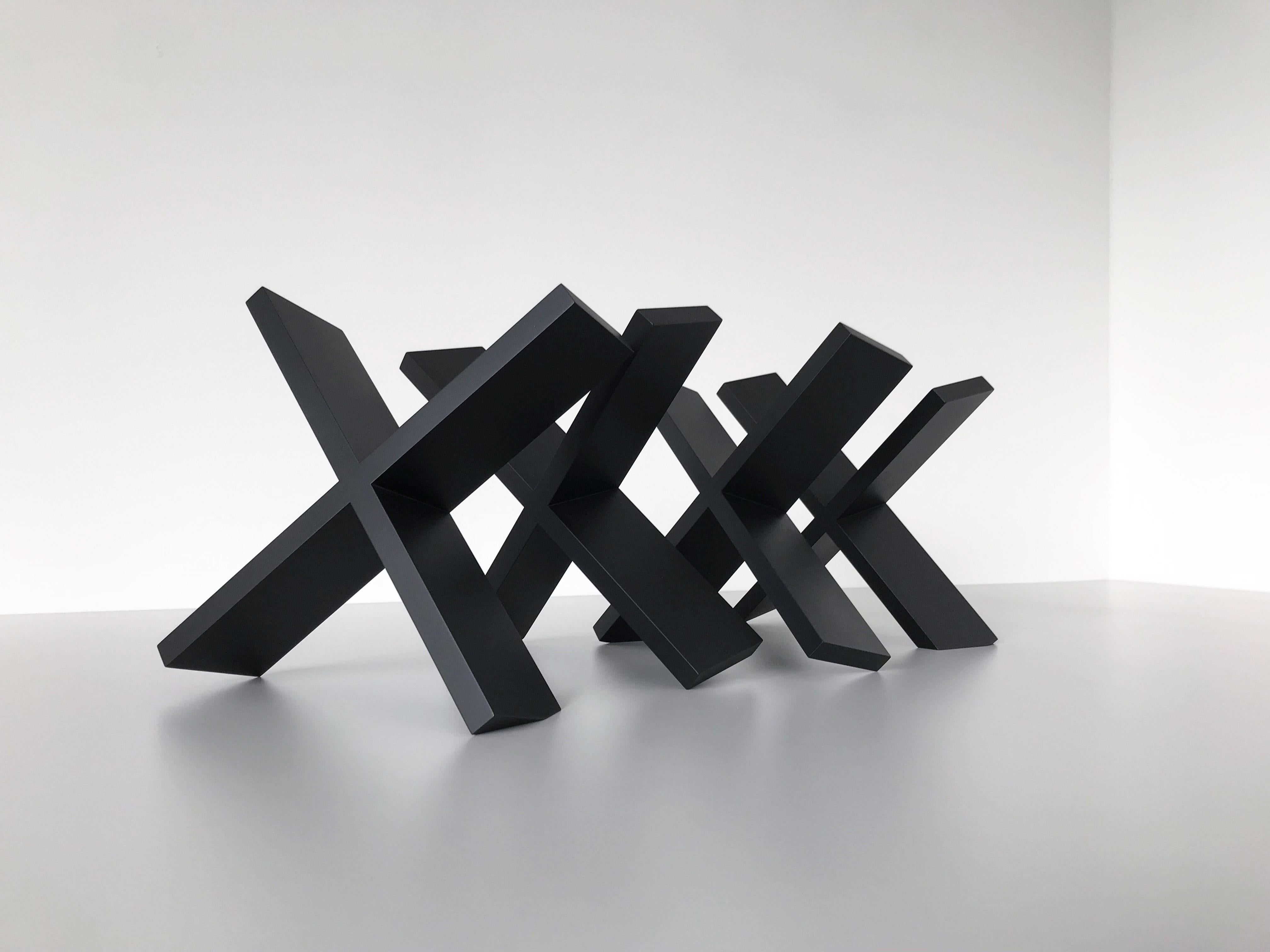 Artist Commentary:
When buildings are condemned,  X's are spray painted on them. It's an interesting symbol of negation, but for me its a way of activating a particular architectural space. This is a study/ small sculpture for my current exhibition