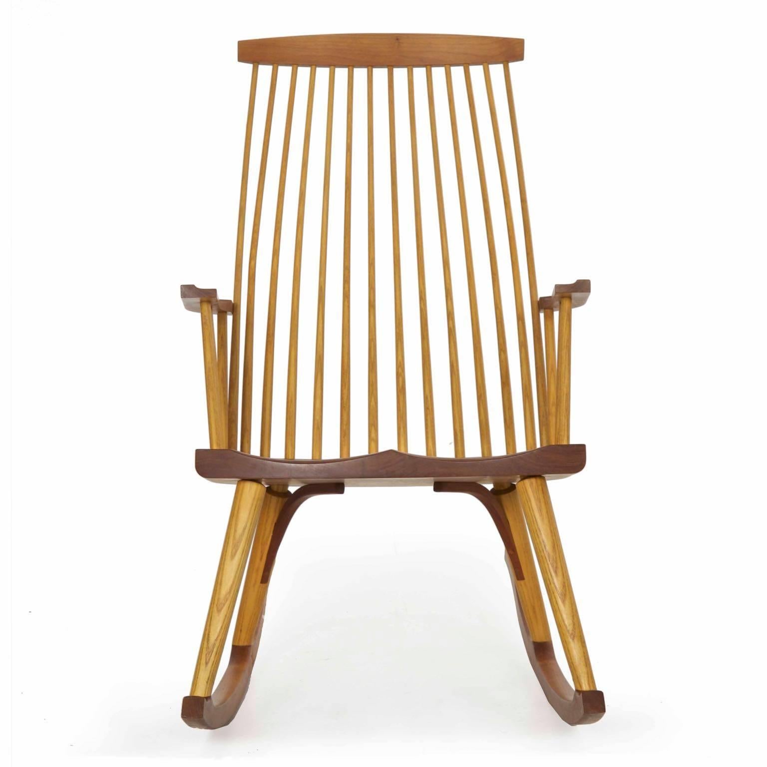 A very finely benchmade modern rocking chair by the firm of Thomas Moser, it was designed in 1984 and named after the Maine town that was home to their first workshop. A rich and striking piece crafted of solid cherry and ash. It is a fresh and