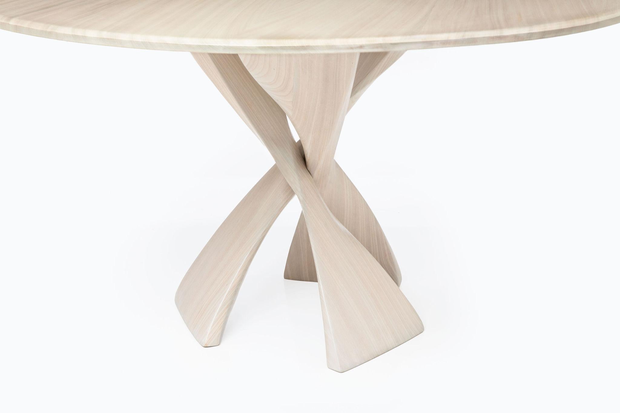 The AvA pedestal table is made up of three identical elements that twist around each other in a repeat pattern. The inspiration for the legs is reminiscent of The Evolution Stool design, also conceived and engineered by Vlad Krasnogorov. An