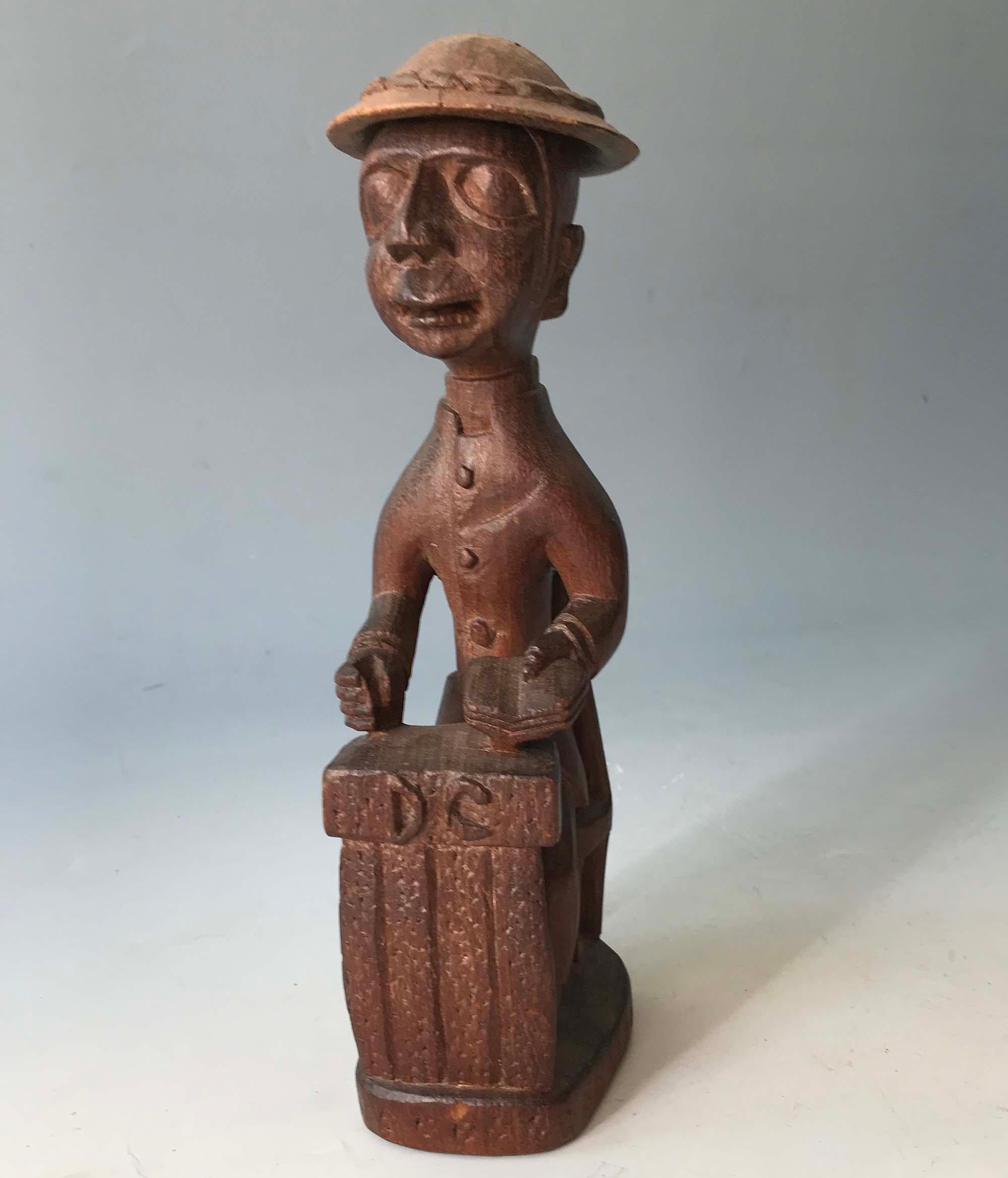 Thomas Ona Odulate carving district commissioner Yoruba African Tribal Nigeria
A carved figure of a British colonial district commissioner in Nigeria 
Circa 1920s/30s,
Measures: Height 22 cm
Condition: Good with minor wear

Thomas Ona (1900-1952),
