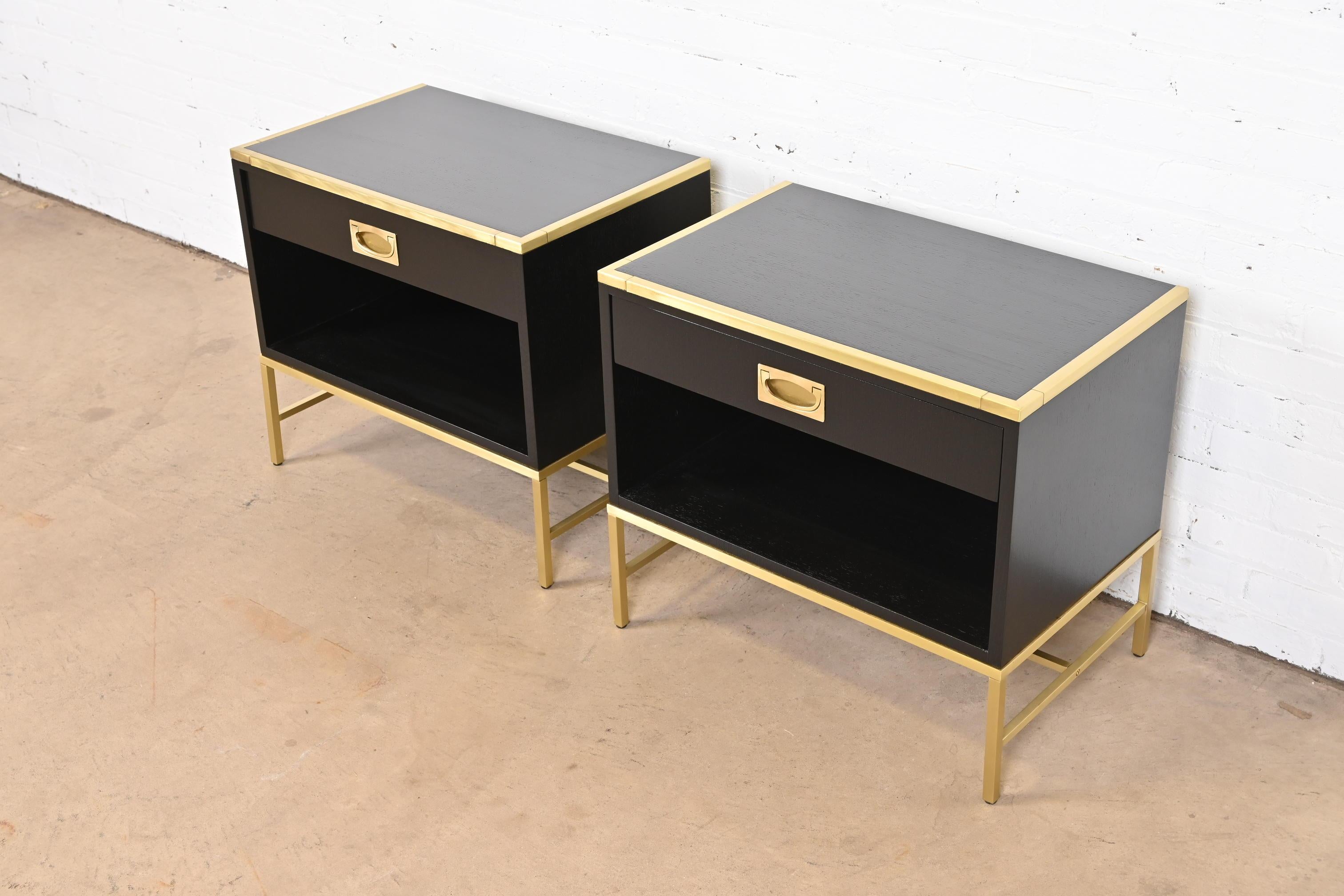 American Thomas Pheasant for Baker Campaign Black Lacquer and Brass Nightstands, Pair