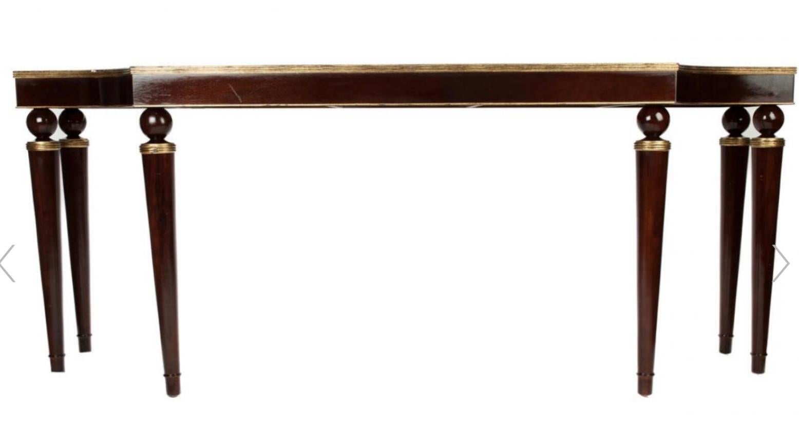 I love the sleek lines of this console table! It was designed by Thomas Pheasant for Baker Furniture. It is mahogany with gilded accents. It is marked and in very good condition.