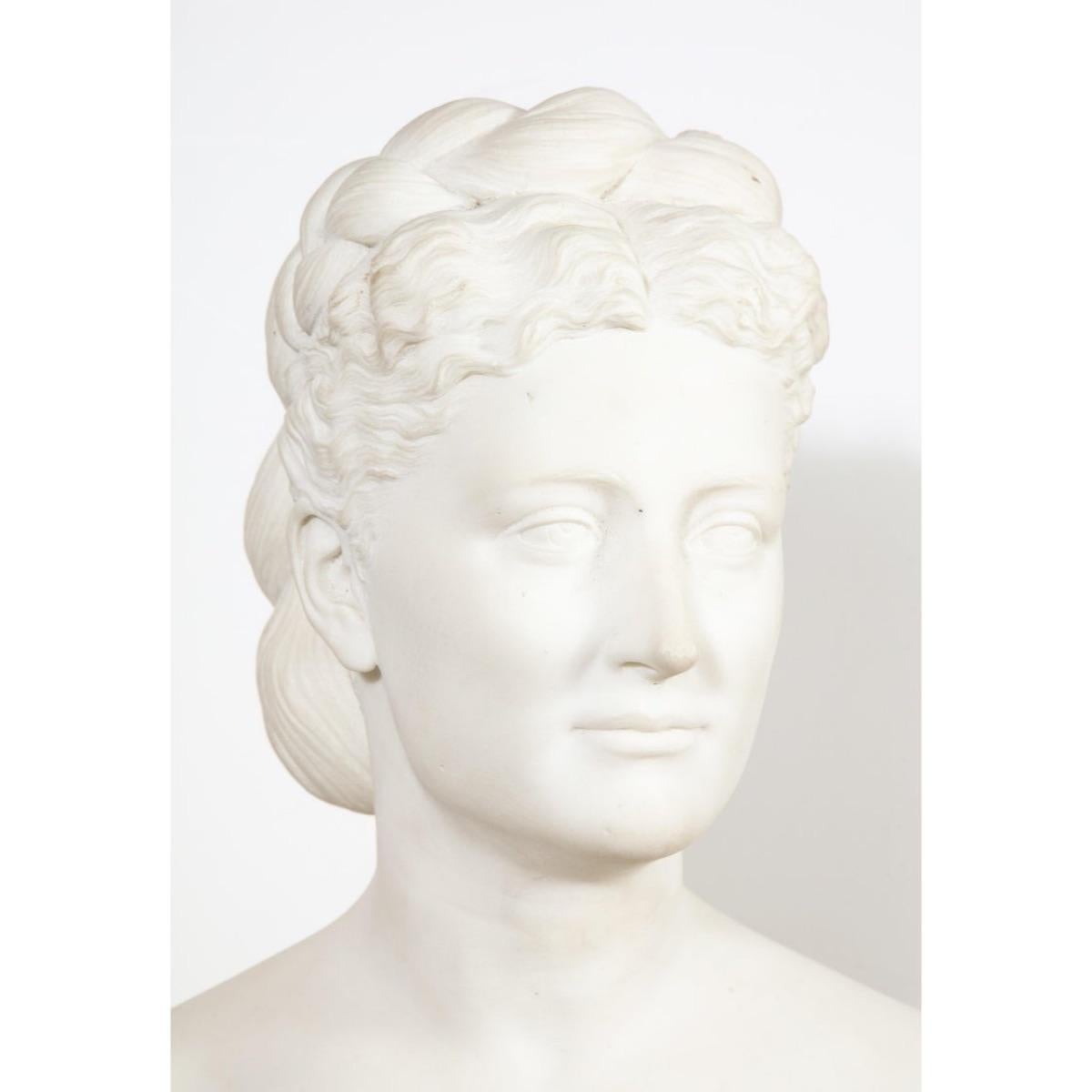 Thomas Ridgeway Gould (1818-1881) an extremely rare American White Marble Bust of A Woman, circa 1870.  

Depicting a beautiful woman with her hair double row, braided in a bun. Very fine quality, a masterpiece, museum sculpture.  

Signed 
