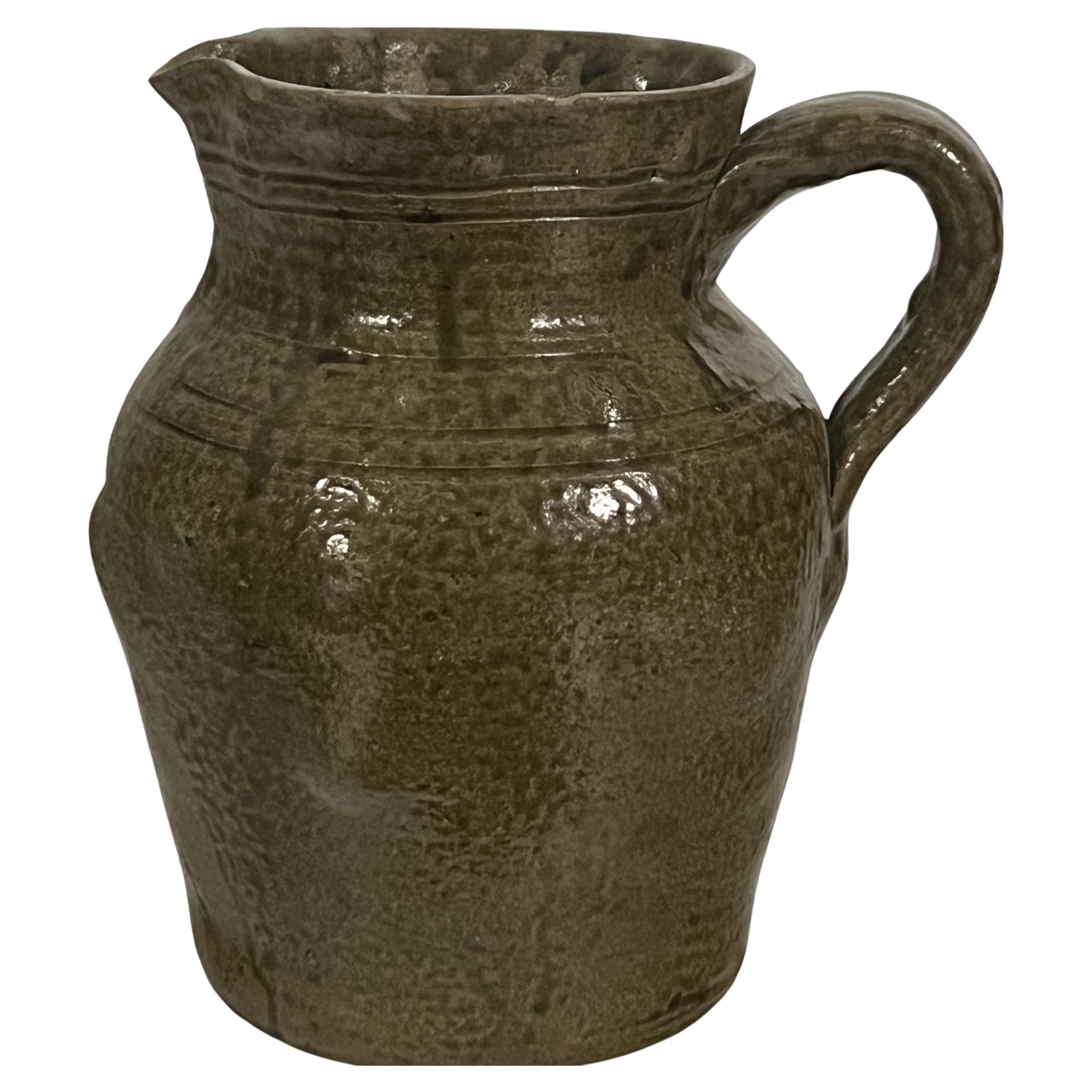 Thomas Ritchie is one of the better documented Catawba Valley NC potters who worked in the mid 19th century up until (it is estimated) about 1900. A number of his jugs, crocks and canning jars survive with various markings that include TR and this