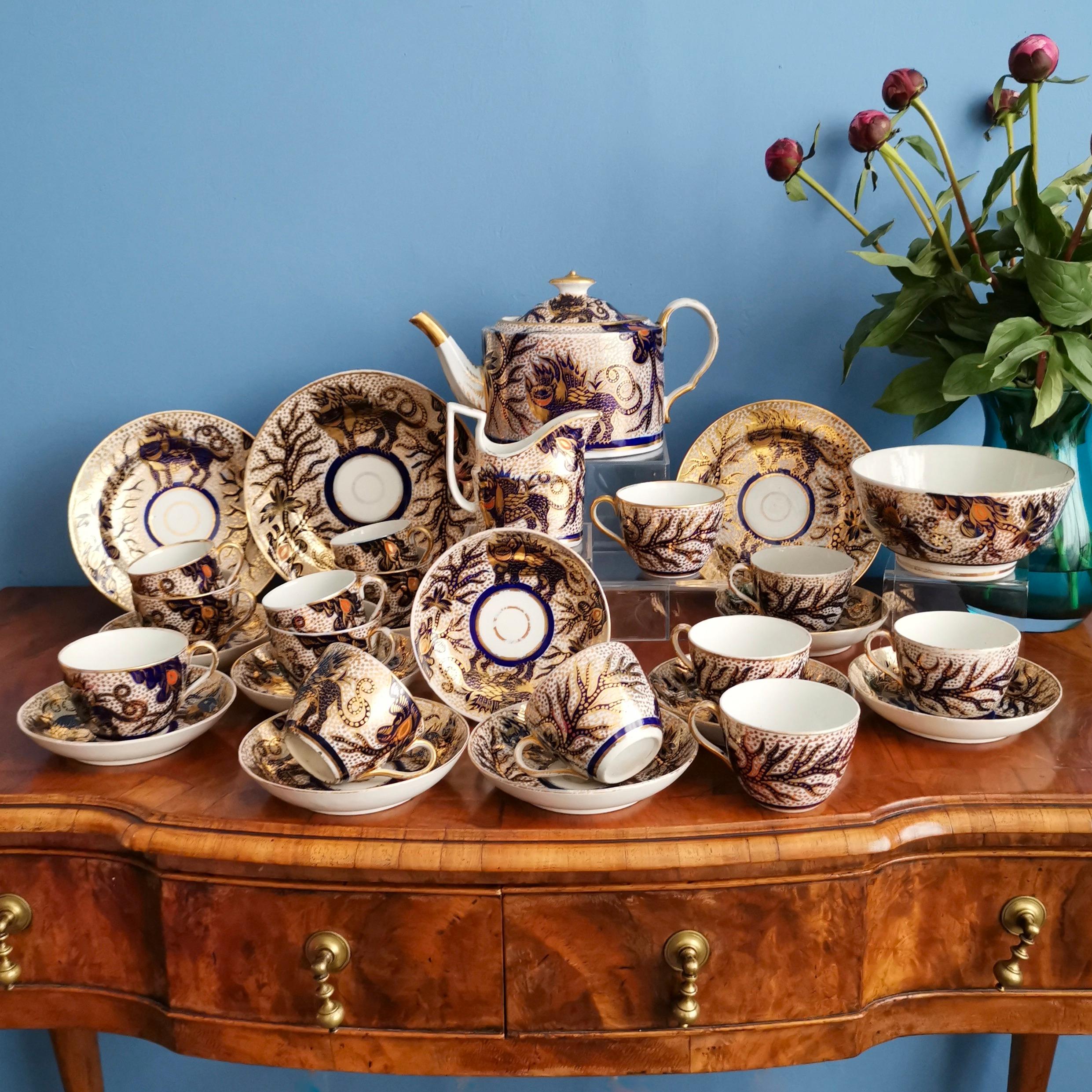 This is a gorgeous and extremely rare tea service made by Thomas Rose (Coalport) in circa 1800. The service consists of a teapot and cover, a milk jug, a large cake plate and two smaller cake plates, three coffee cans, eleven teacups, ten saucers